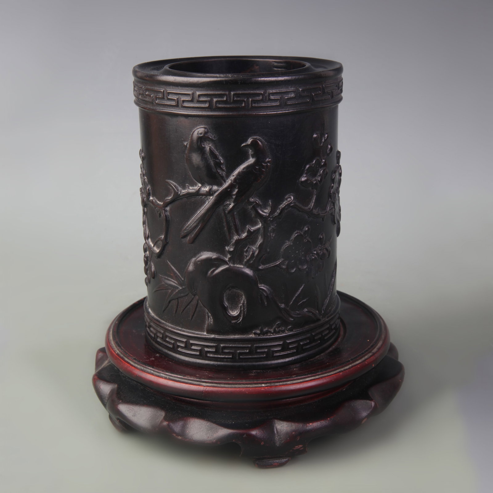 A HARDWOOD BRUSH POT CARVED WITH BIRD-AND-FLOWER MOTIF: Qing Dynasty; Diameter: 4.4 inch; High: 5.9 inch; Wooden base for diplay only