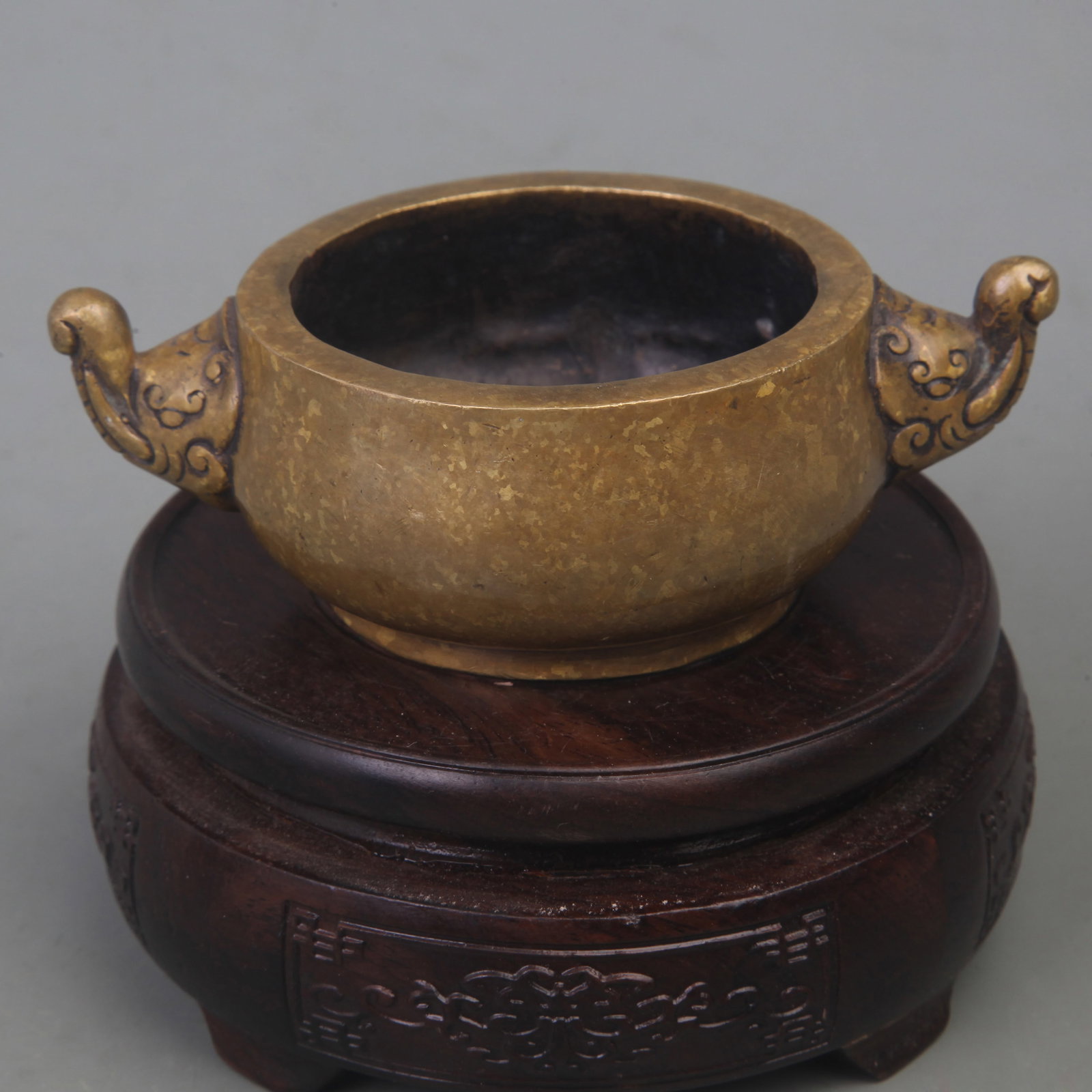 A FINE BRONZE GILDED ELEPHANT EAR CENSER: Qing Dynasty; Diameter: 4.8 inch; High: 1.5 inch; Wooden base for diplay only