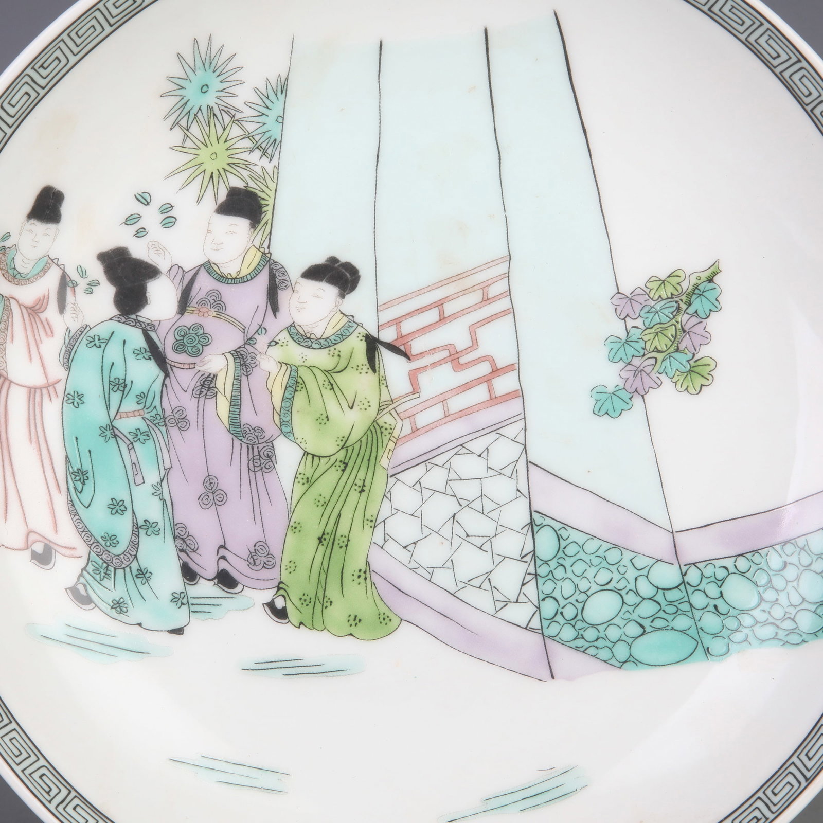 FAMILLE ROSE PLATE WITH HUMAN STORY FIGURES: Qing Dynasty Qian Long Period; Diameter: 8.8 inch; High: 1.8 inch; Wooden base for diplay only