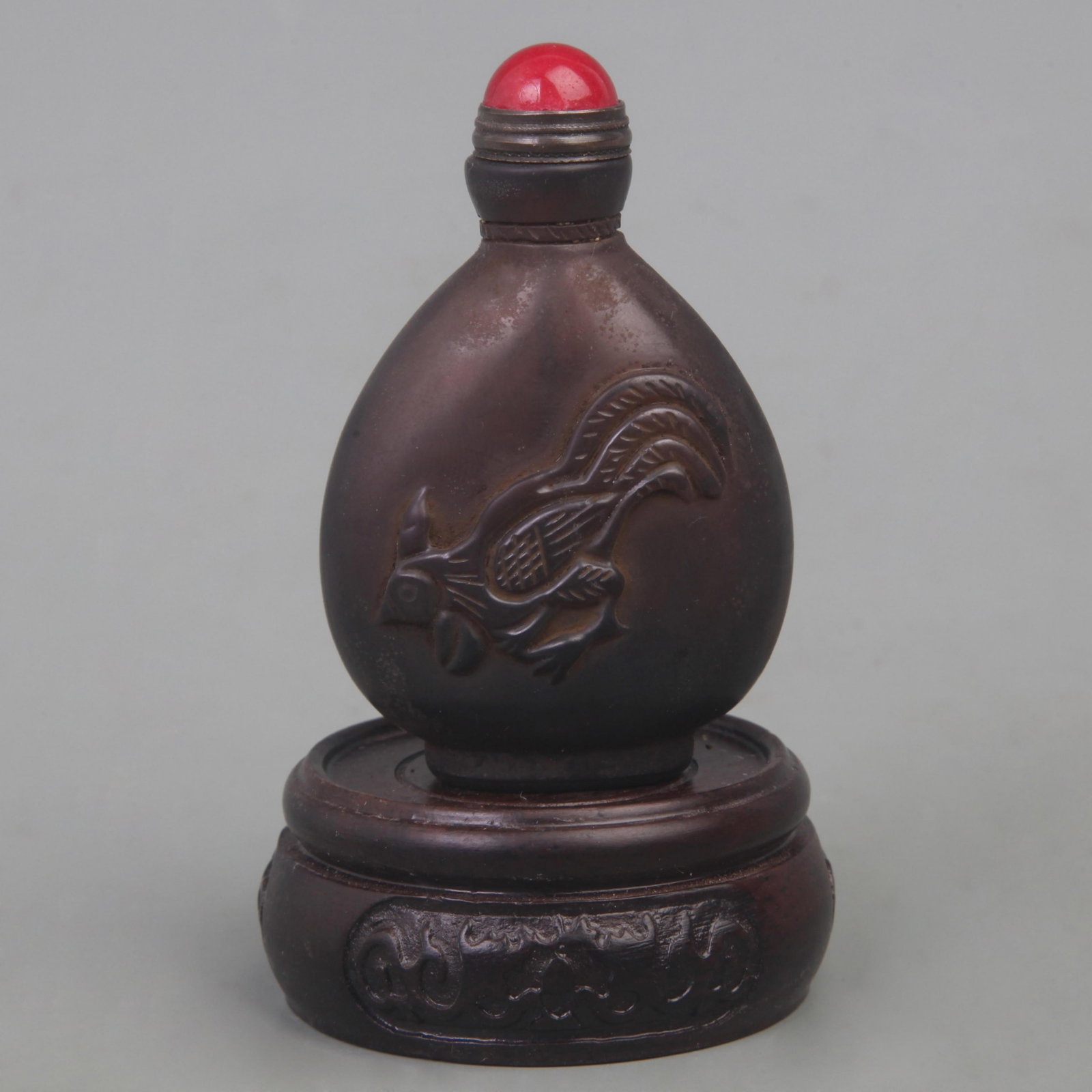 GLASS SNUFF BOTTLE WITH FLOWER AND BIRD DESIGN: Qing Dynasty; High: 2.8 inch; Width: 1.8 inch; Diameter: 1.0 inch; Wooden base for diplay only