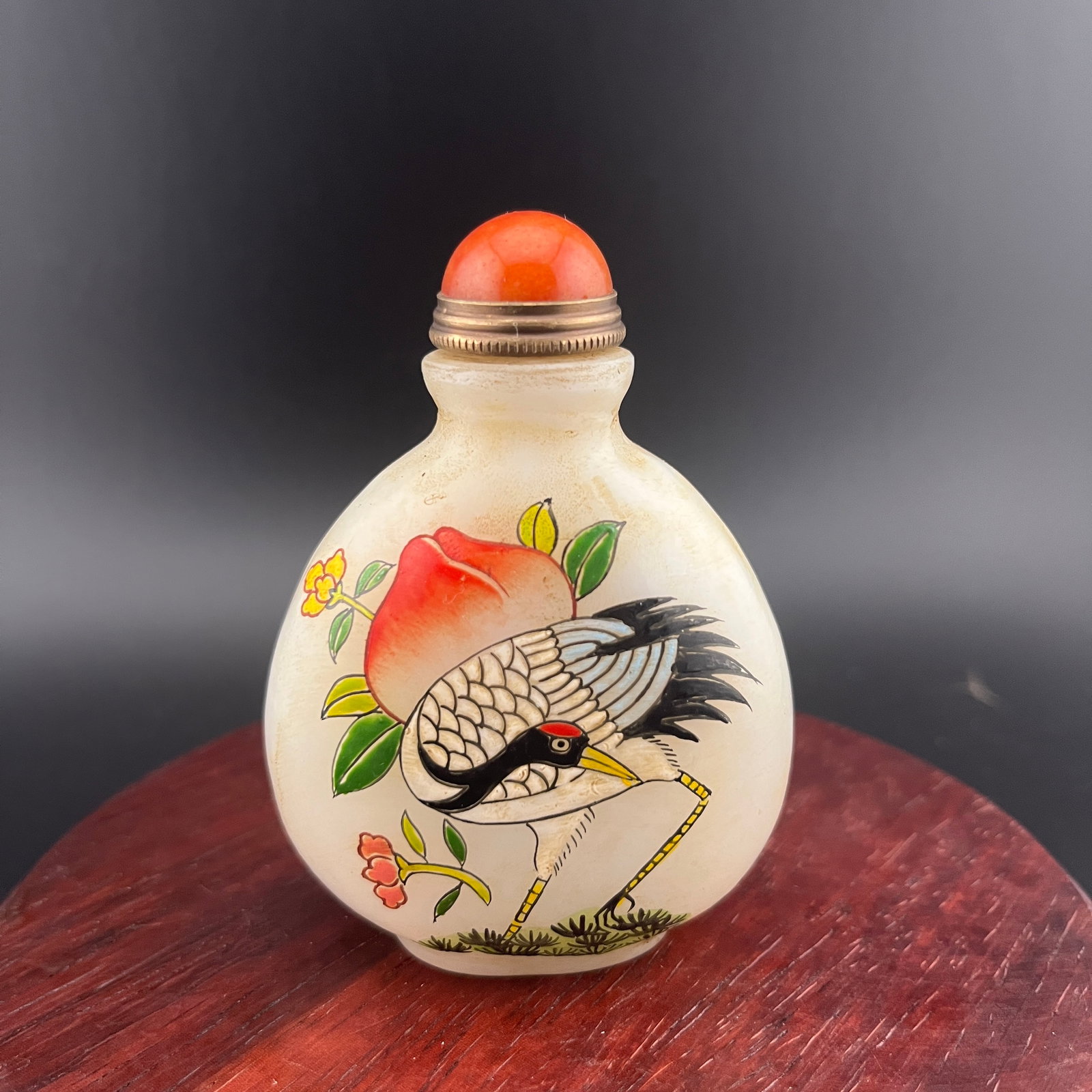 A FINE GLASS MADE CRANE PAINTED SNUFF BOTTLE: Modern; Long: 2.2 inch; Width: 1.18 inch; High: 3 inch; Wooden base for diplay only