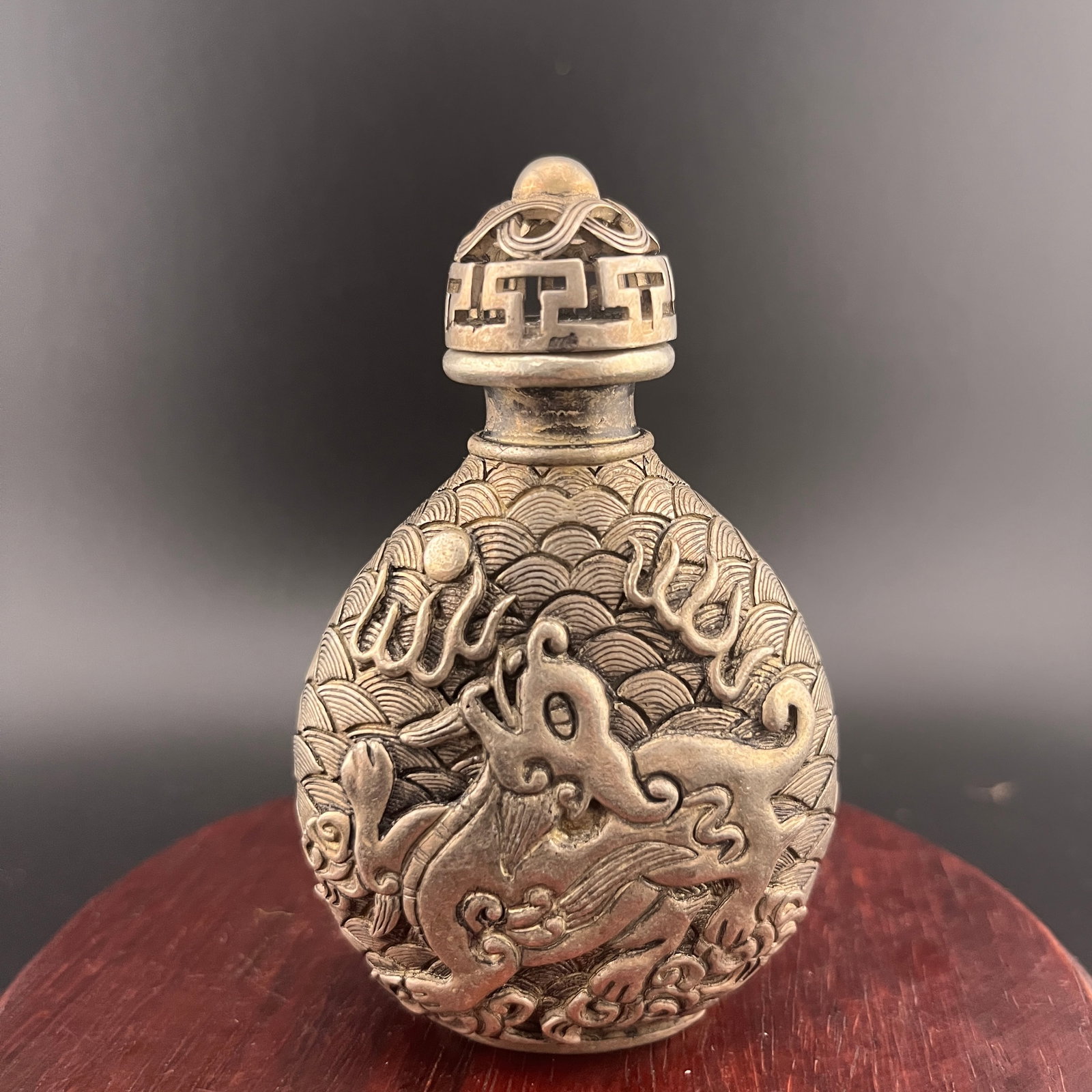 CARVED METAL DRAGON SNUFF BOTTLE: Republic Period; Long: 2.26 inch; Width: 2.9 inch; High: 3.6 inch; Wooden base for diplay only