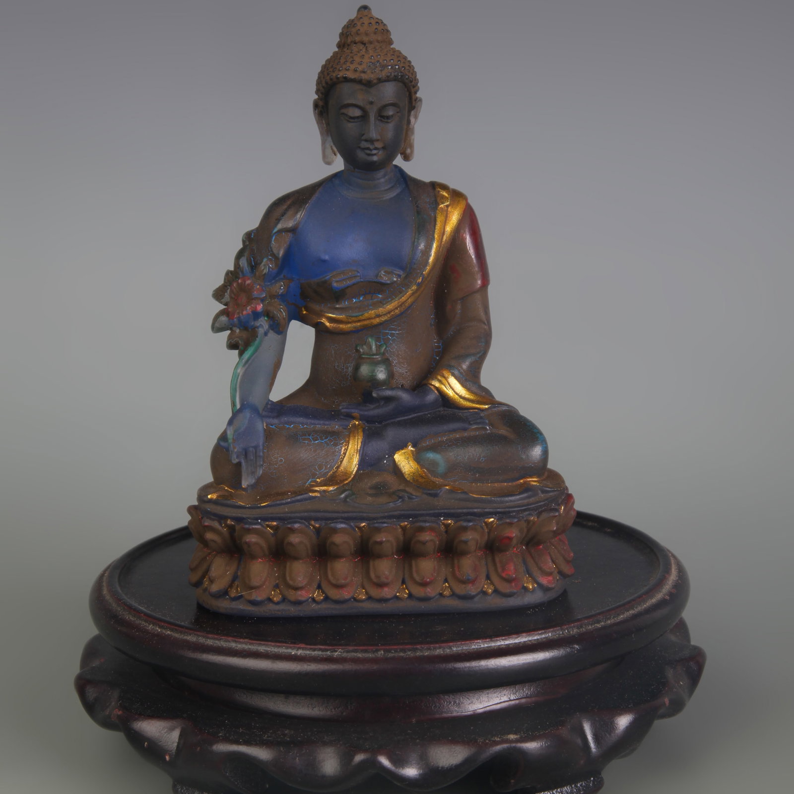 A GILT AND GLASS FIGURE OF MEDICINE BUDDHA: Qing Dynasty Qian Long Period; Width: 3.0 inch; High: 4.5 inch; Wooden base for diplay only