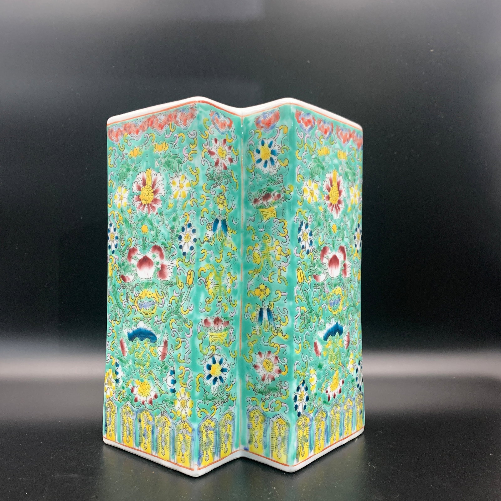 FAMILLE-ROSE TURQUOISE-GROUND 'LOTUS AND EIGHT BUDDHIST SYMBOLS' BRUSH POT