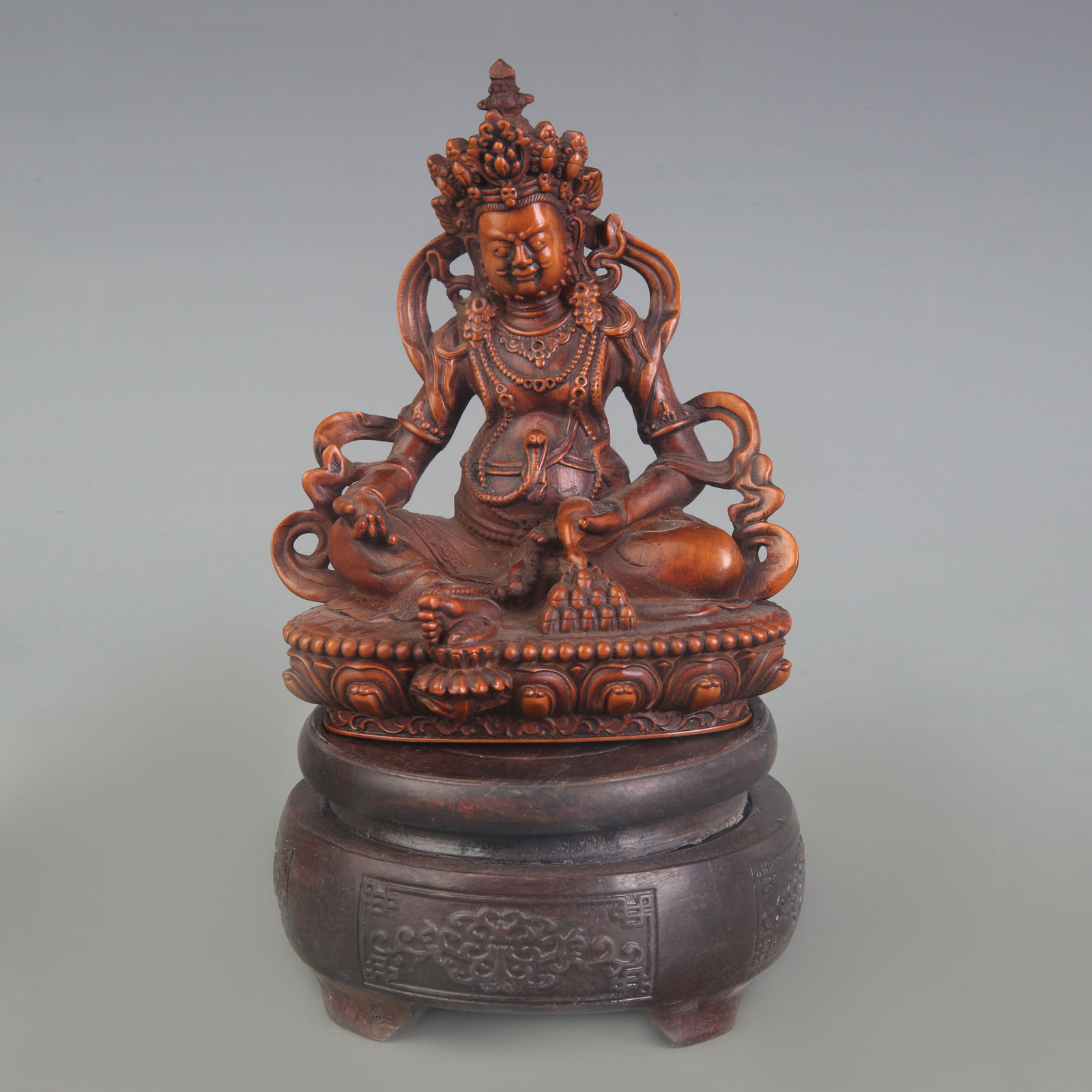 A BOXWOOD FIGURE OF YELLOW JAMBHALA (GOD OF WEALTH)
