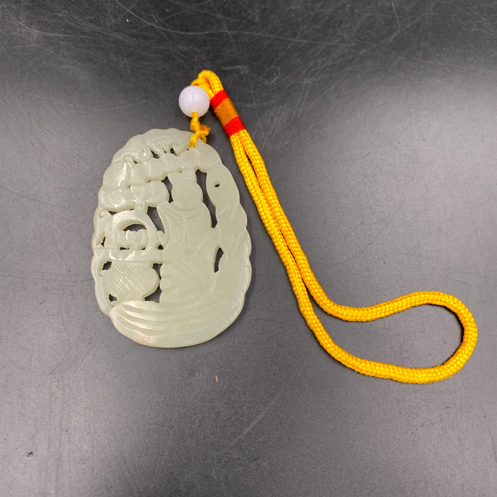 WHITE JADEITE "SCHOLAR AND BASKET" PENDANT