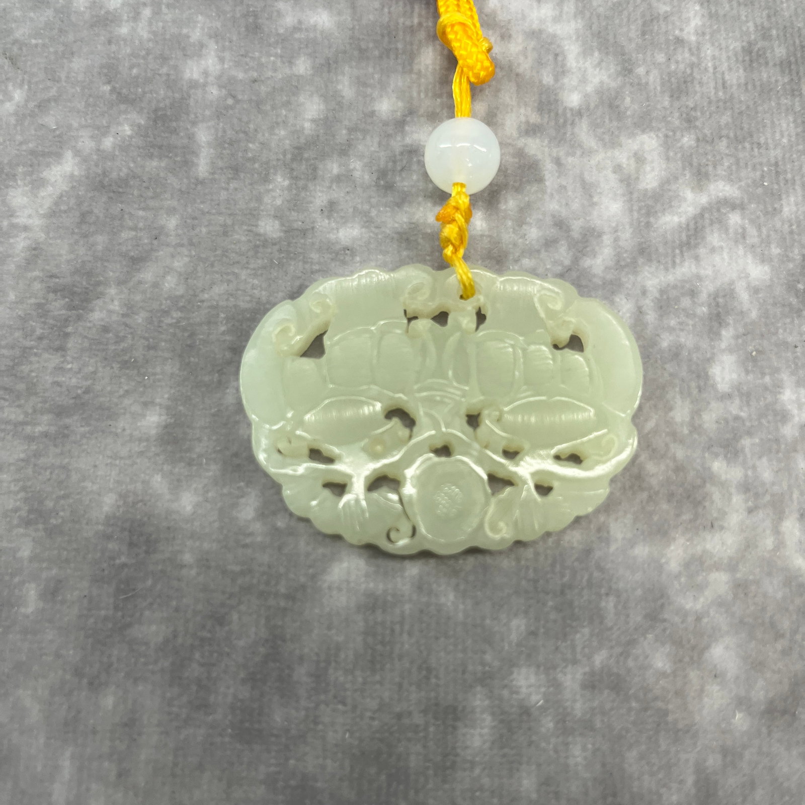 FINE HAND-CARVED JADE OPENWORK AMULET PLAQUE