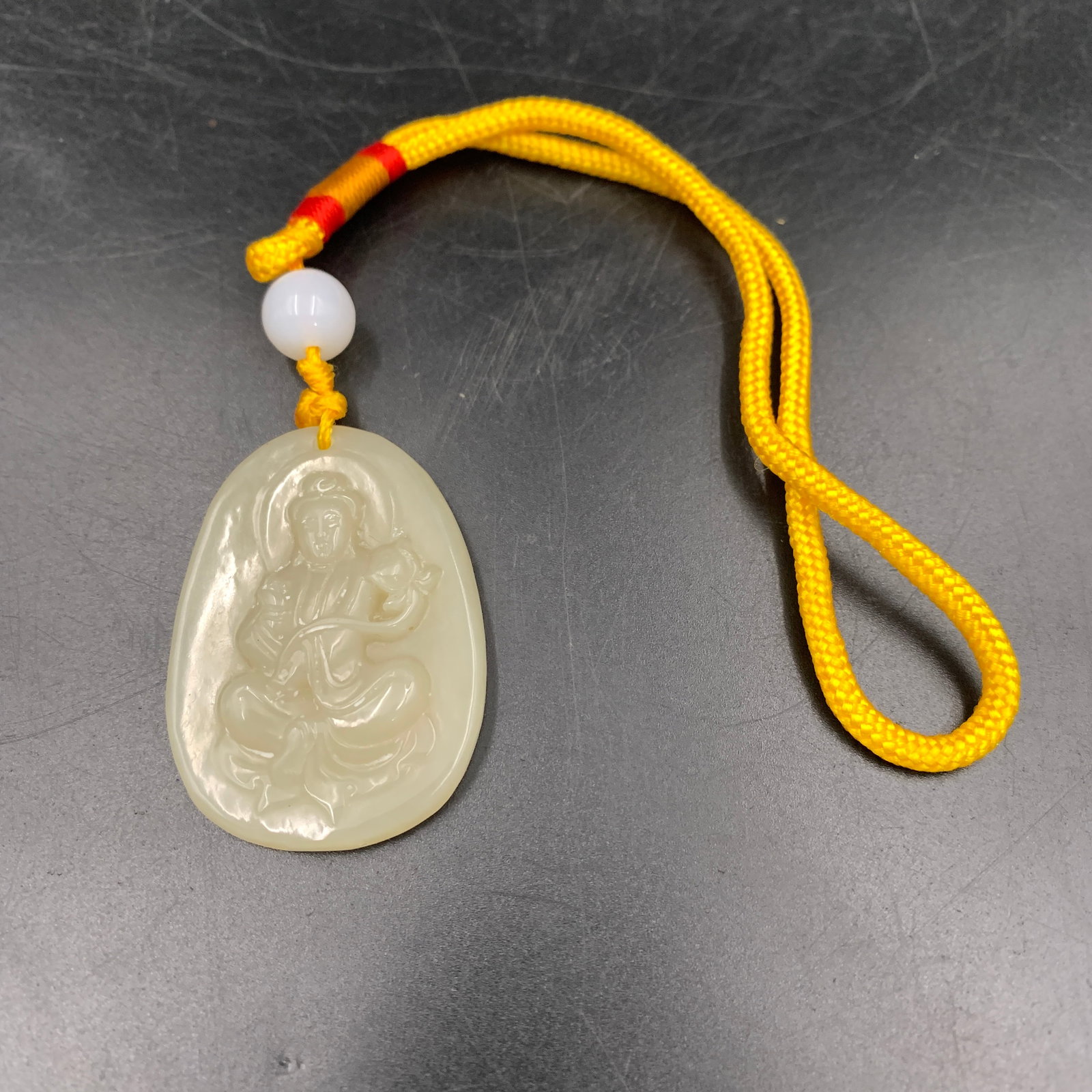 CARVED WHITE JADEITE BODHISATTVA MANJUSHRI PENDANT