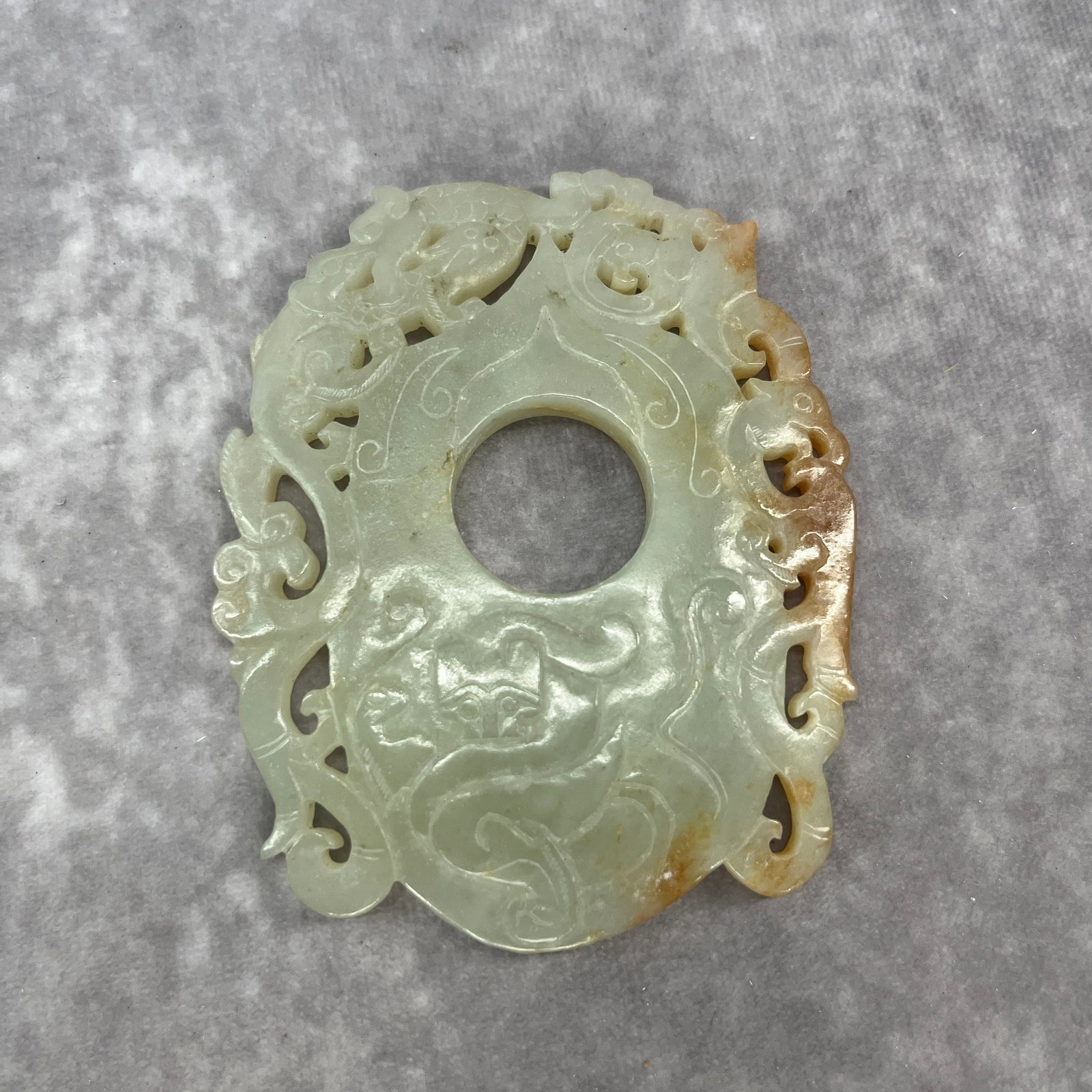 A CARVED NEPHRITE JADE OPENWORK BI DISC WITH COILING DRAGONS (1 of 4)