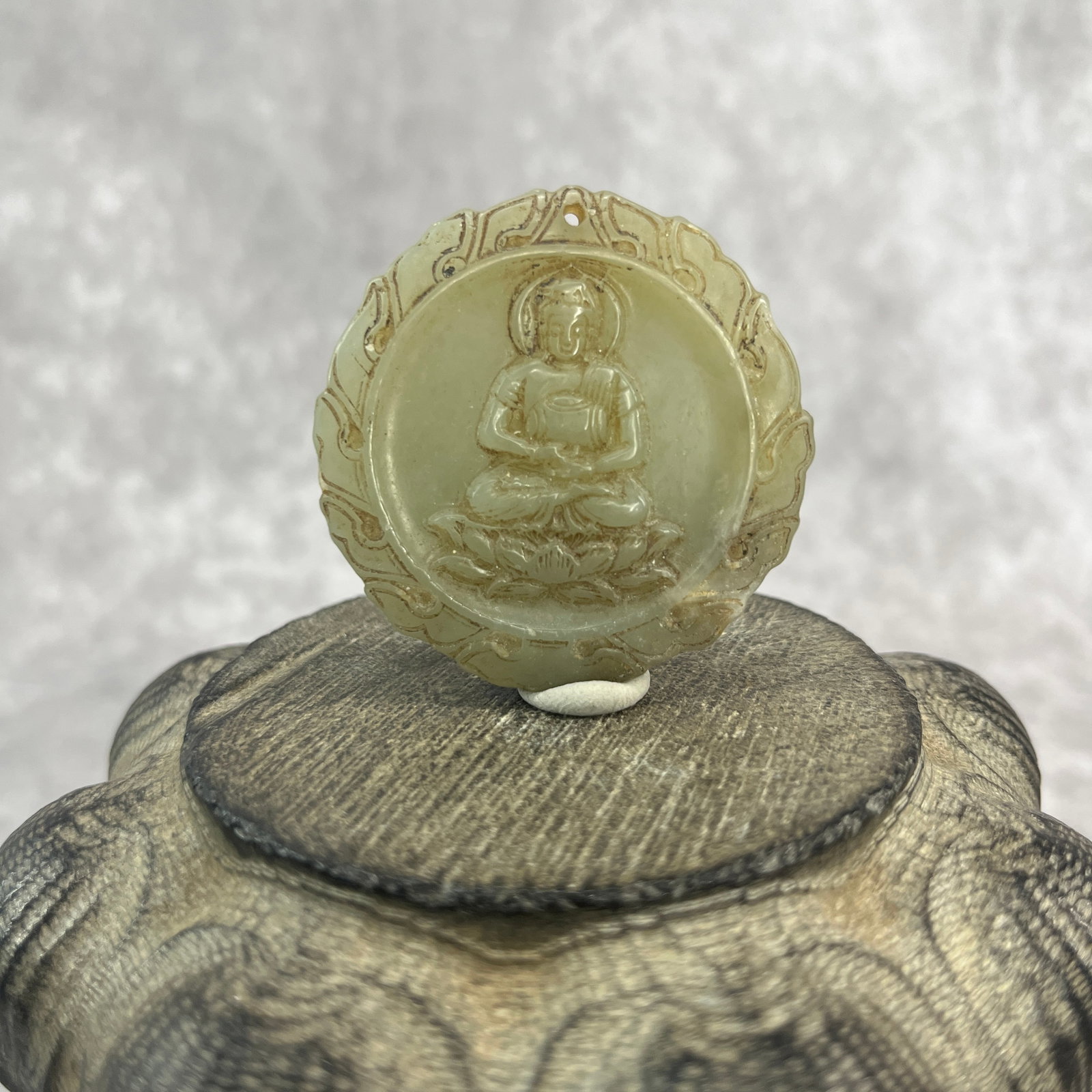FINE HAND-CARVED JADE AMULET TABLET WITH GUANYIN FIGURE: Qing Dynasty; High: 0.38 inch; Diameter: 1.9 inch