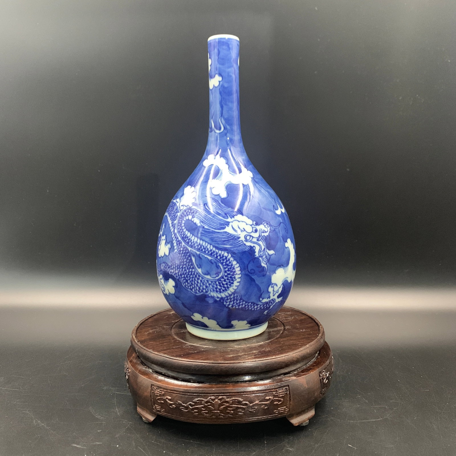 BLUE-GROUND REVERSE-DECORATED 'DRAGON AND CLOUDS' PORCELAIN BOTTLE VASE (1 of 5)