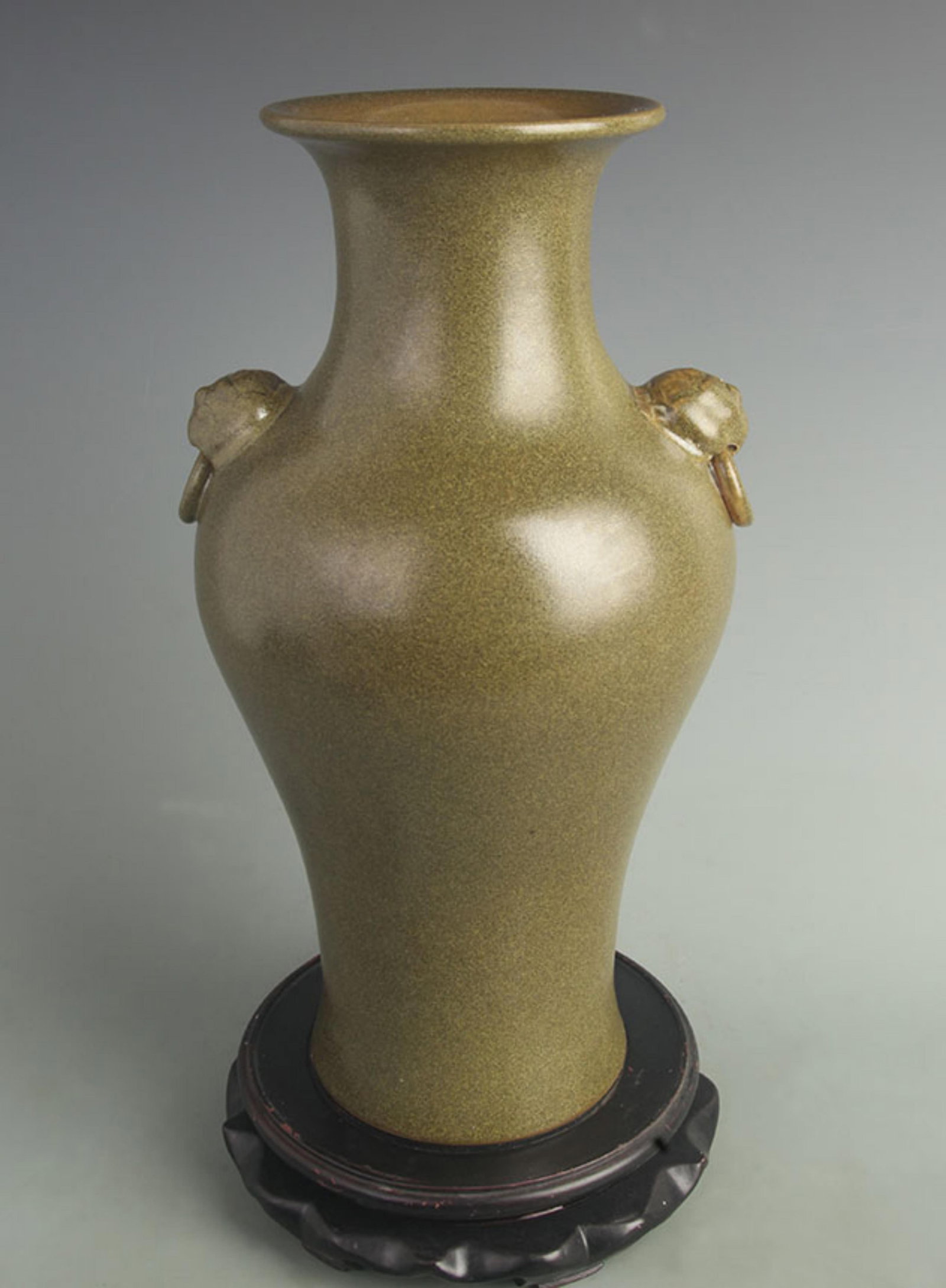 A FINE TEA LEAF COLOR LION EAR PORCELAIN VASE: Qing Dynasty Yong Zheng Period; High: 14.0 inch; Width: 7.00 inch; Wooden base for diplay only