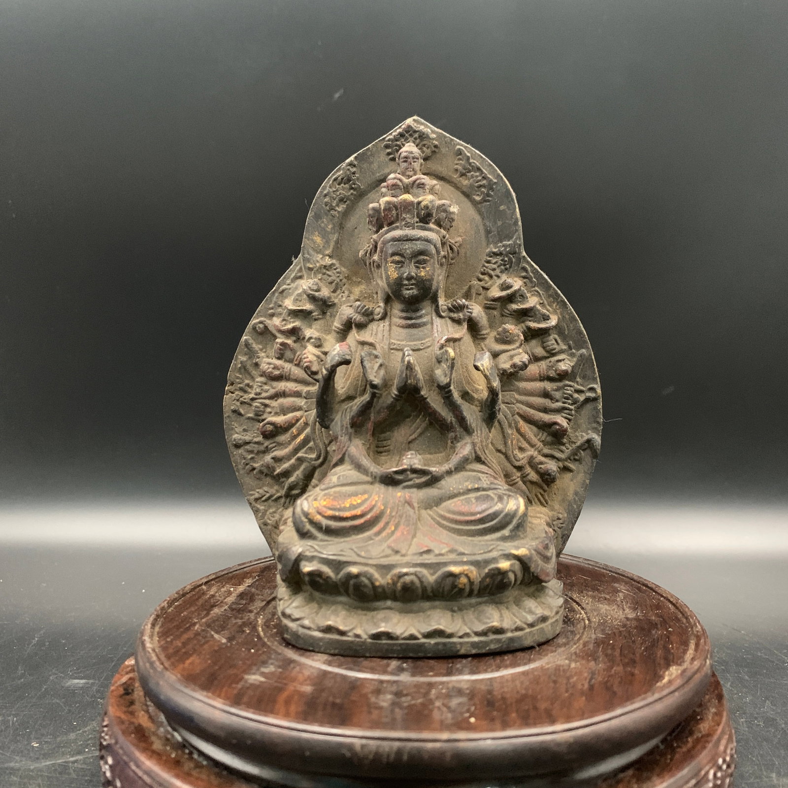 PARTIAL-GILT BRONZE FIGURE OF THOUSAND-ARMED GUANYIN: Qing Dynasty; Long: 4.5 inch; Width: 2.2 inch; High: 5.6 inch; Wooden base for diplay only