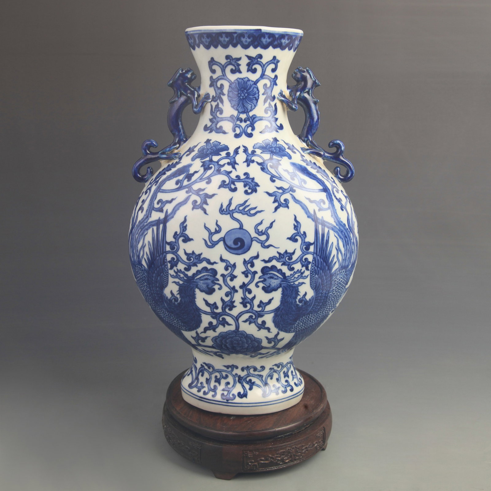 A FINE BLUE AND WHITE PHOENIX PATTERN FLAT PORCELAIN VASE: Qing Dynasty Qian Long Period; High: 14.0 inch; Diameter: 8.00 inch; Wooden base for diplay only