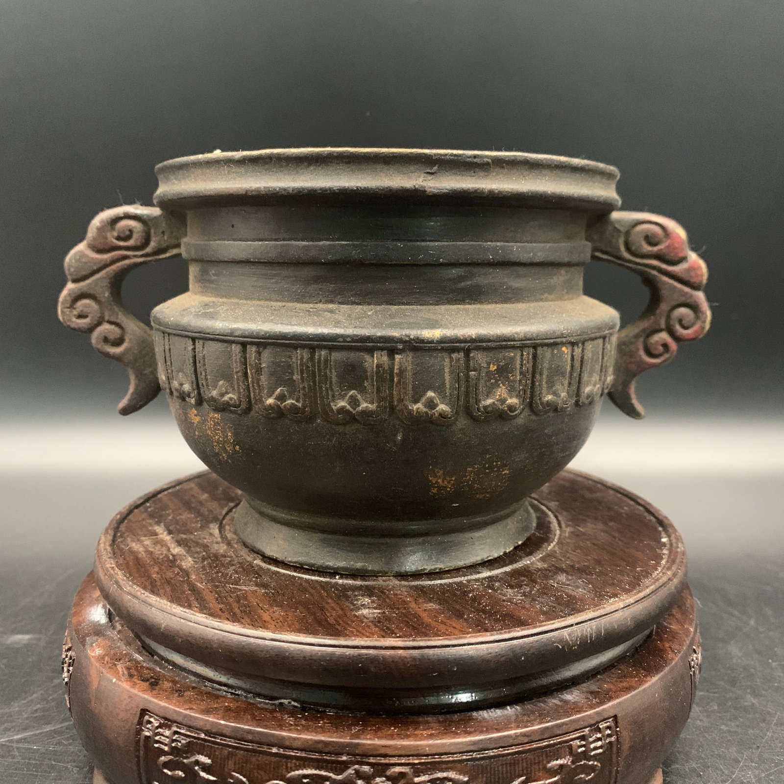 A BRONZE 'GUI-FORM' TWO-HANDLED CENSER
