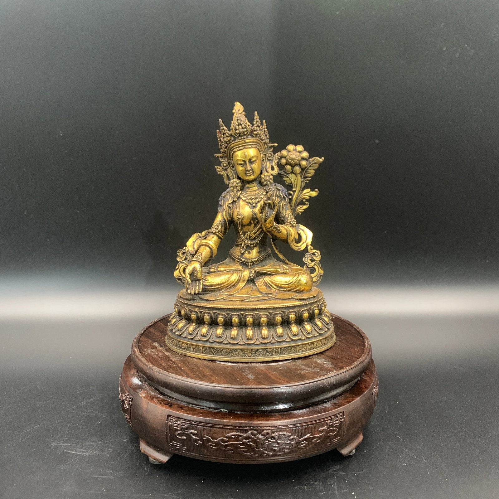 A FINE BRONZE FIGURE OF WHITE TARA: 19th Century; Long: 4.4 inch; Width: 3.5 inch; High: 6.1 inch; Wooden base for diplay only