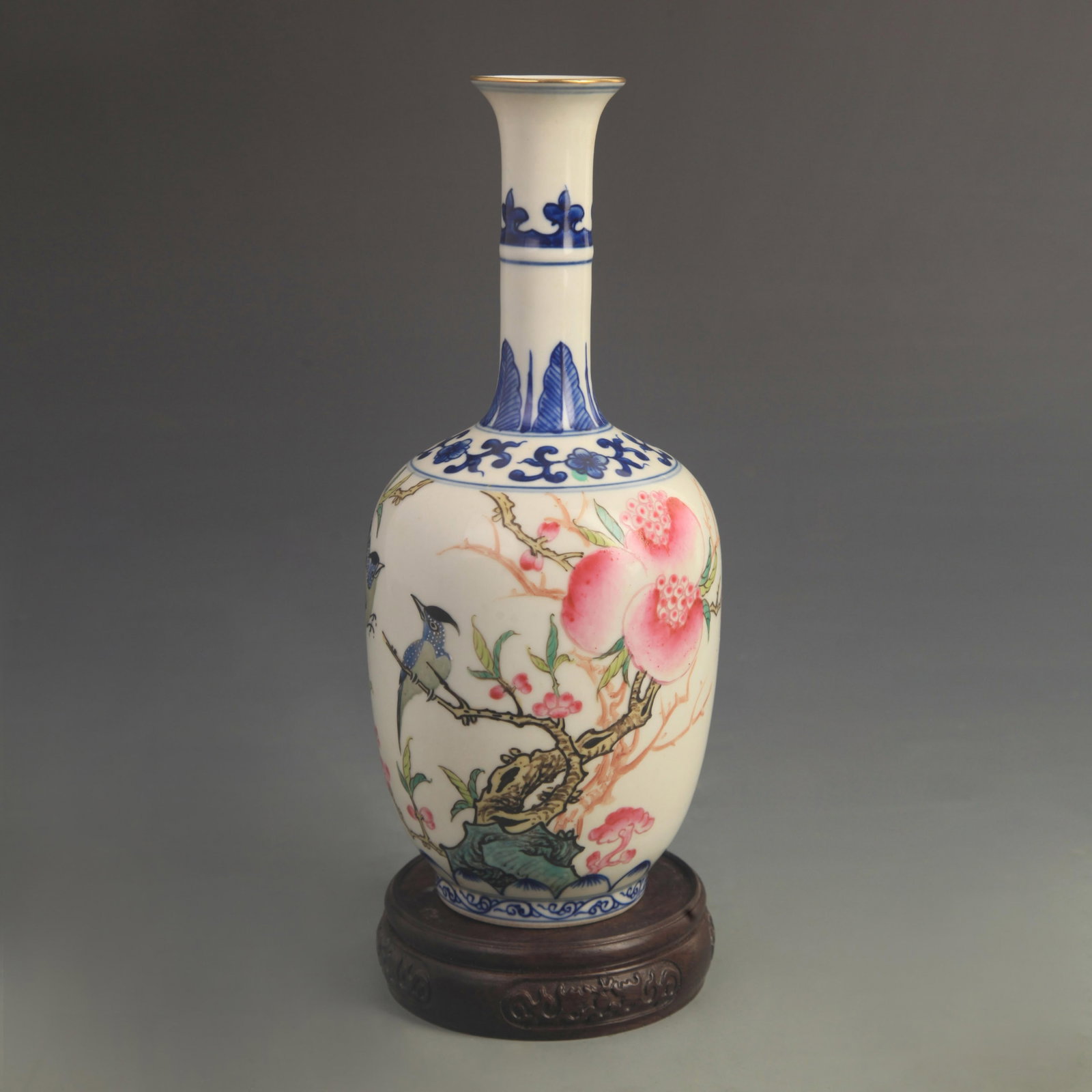 FAMILLE ROSE LONG-NECK PORCELAIN VASE WITH FLORAL AND BIRD PATTERNS: Qing Dynasty Qian Long Period; High: 9.40 inch; Diameter: 3.80 inch; Wooden base for diplay only