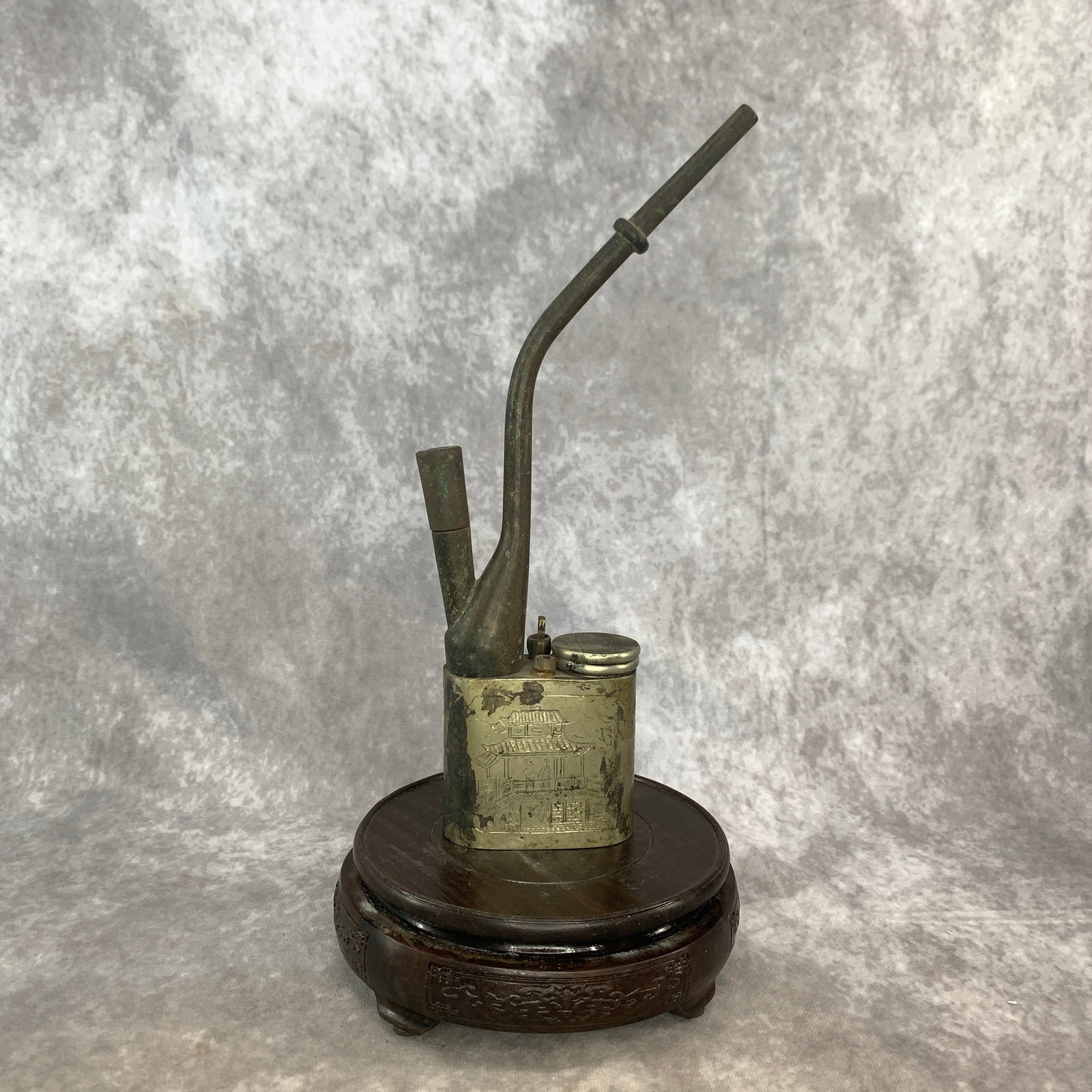 A FINELY CARVED REPUBLIC CHINA PERIOD WATER SMOKING PIPE: Republic Period; Long: 3.2 inch; Width: 1.5 inch; High: 11.5 inch; Wooden base for diplay only