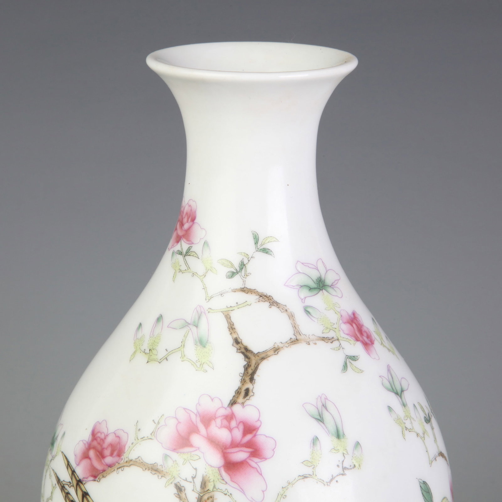A FAMILLE-ROSE FLORAL AND BIRD PORCELAIN VASE: Qing Dynasty Qian Long Period; Diameter: 2.7 inch; High: 9.2 inch; Wooden base for diplay only
