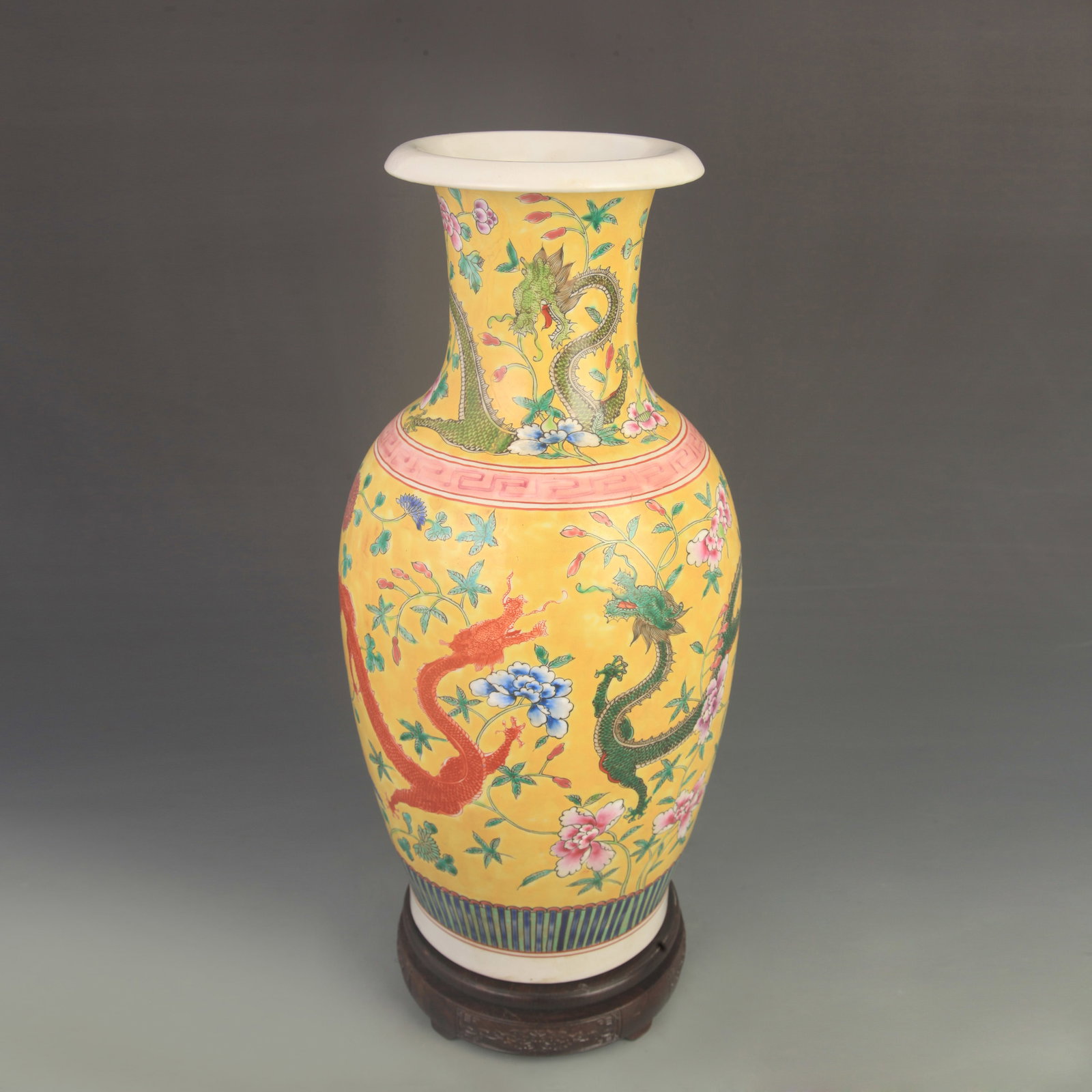 FAMILLE ROSE GLAZED YELLOW-GROUND DRAGON PATTERN PORCELAIN VASE: Qing Dynasty Yong Zheng Period; High: 16.0 inch Diameter: 7.20 inch; Wooden base for diplay only