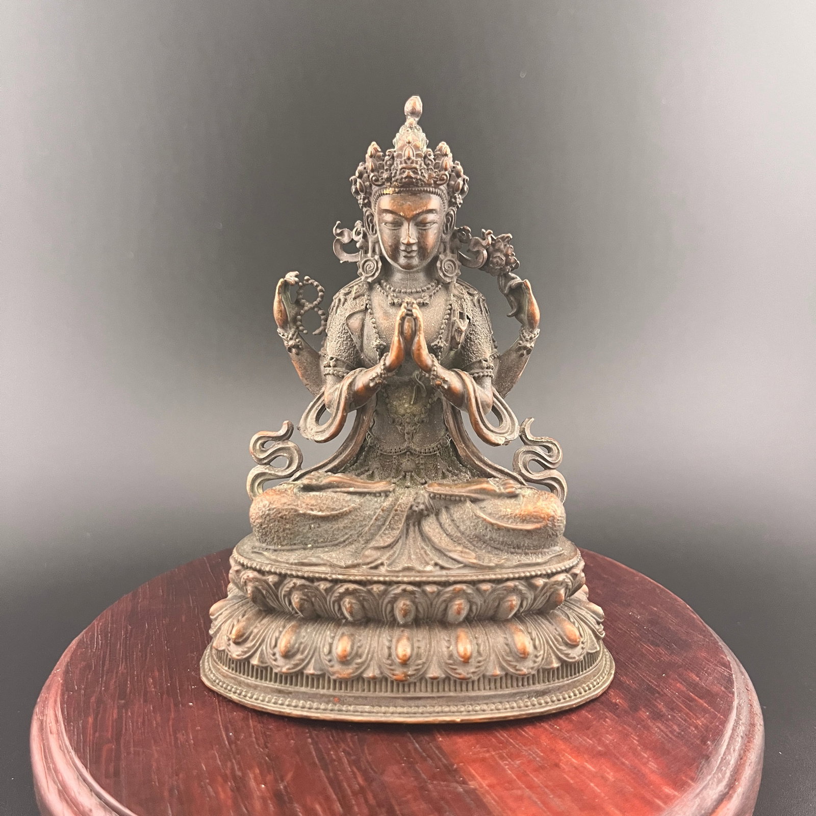 A FINE SMALL BRONZE FOUR-ARMED AVALOKITESHVARA