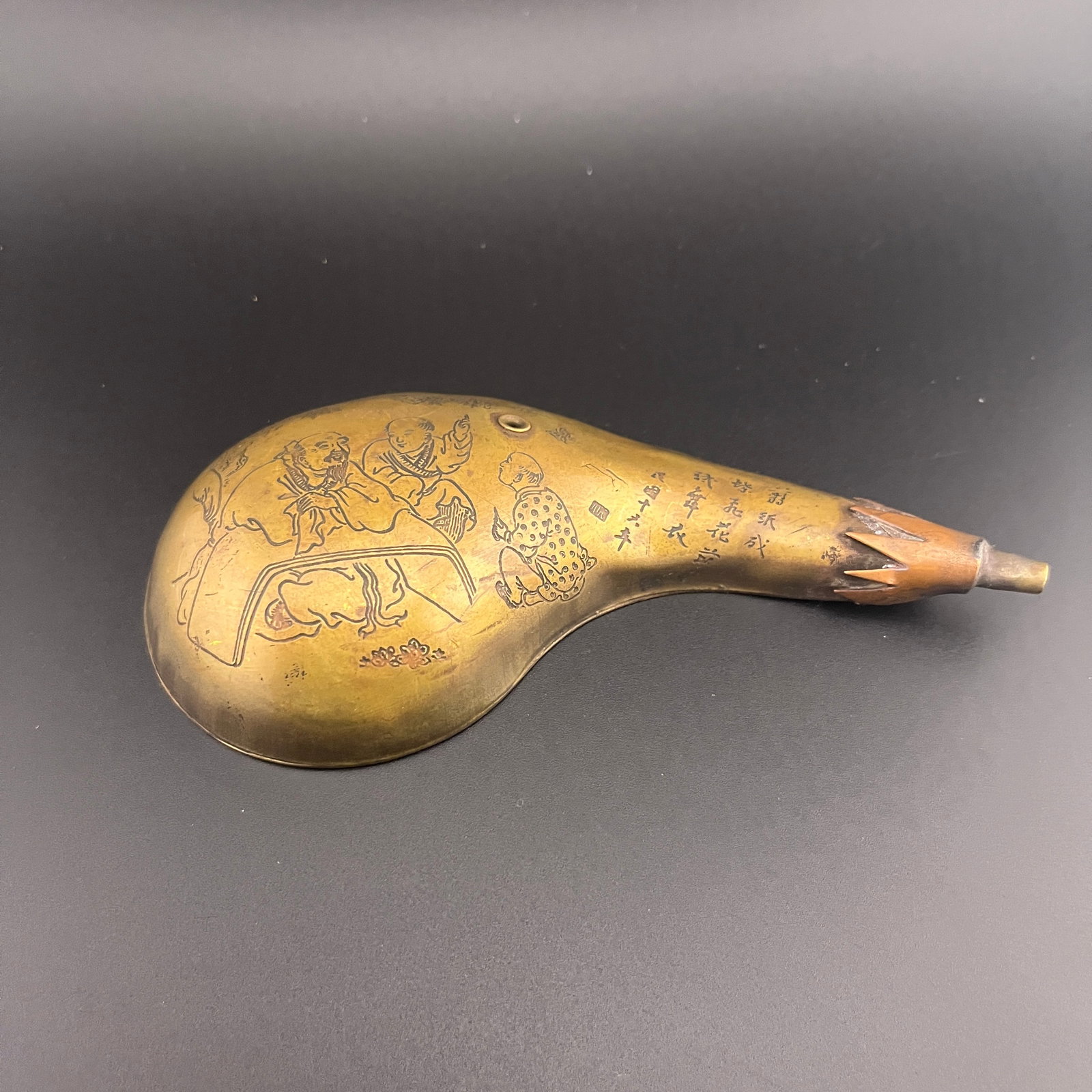A FINELY CARVED BRONZE GROUND SHAPED WATER DROPPER