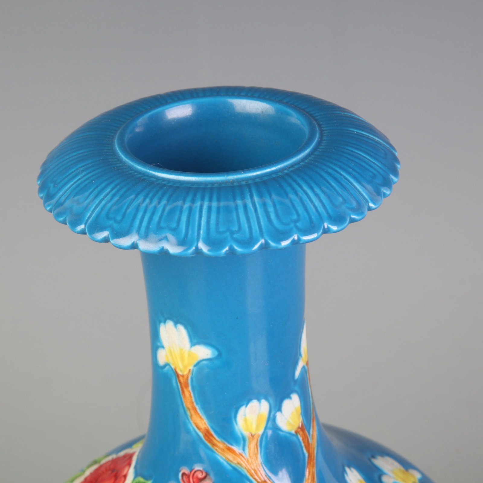 BLUE GLAZE CARVED FLORAL BIRD PATTERN PORCELAIN VASE: Qing Dynasty Qian Long Period: Diameter: 3.1 inch; High: 8.5 inch; Wooden base for diplay only