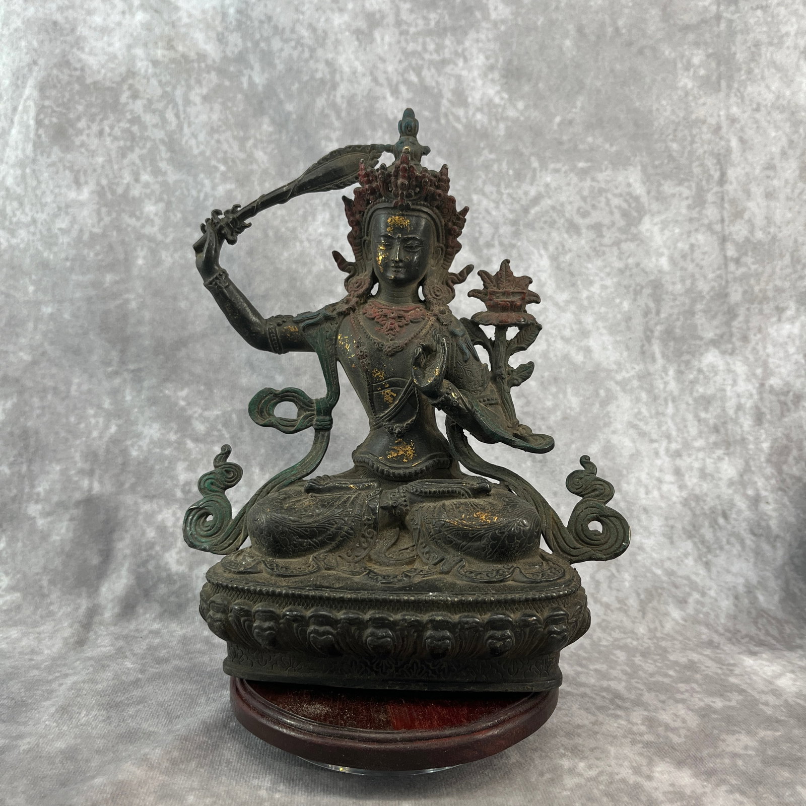 A FINE BRONZE MANJUSHRI STATUE