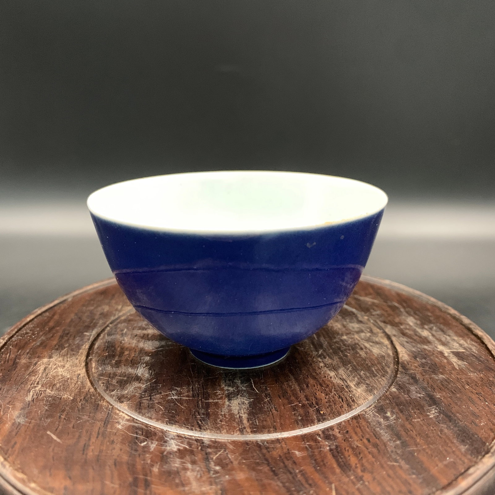 POWDER-BLUE PORCELAIN TEA CUP (SACRIFICIAL BLUE): Ming Dynasty Style; Long: 3.2 inch; Width: 3.2 inch; High: 1.8 inch; Diameter: 3.2 inch; Wooden base for diplay only