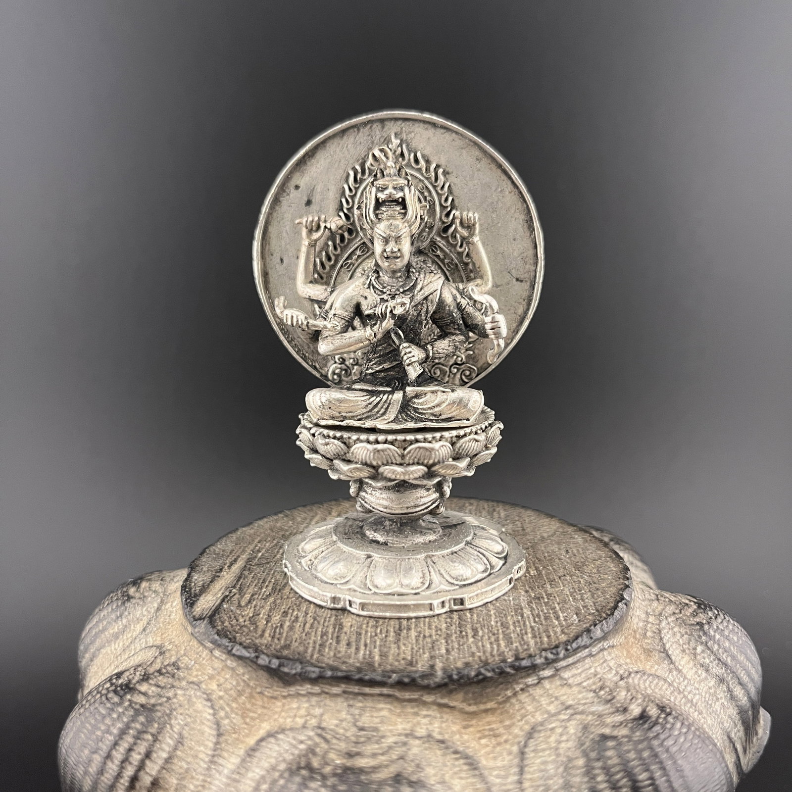 A SMALL WHITE BRONZE THOUSAND HAND GUAN YIN STATUE