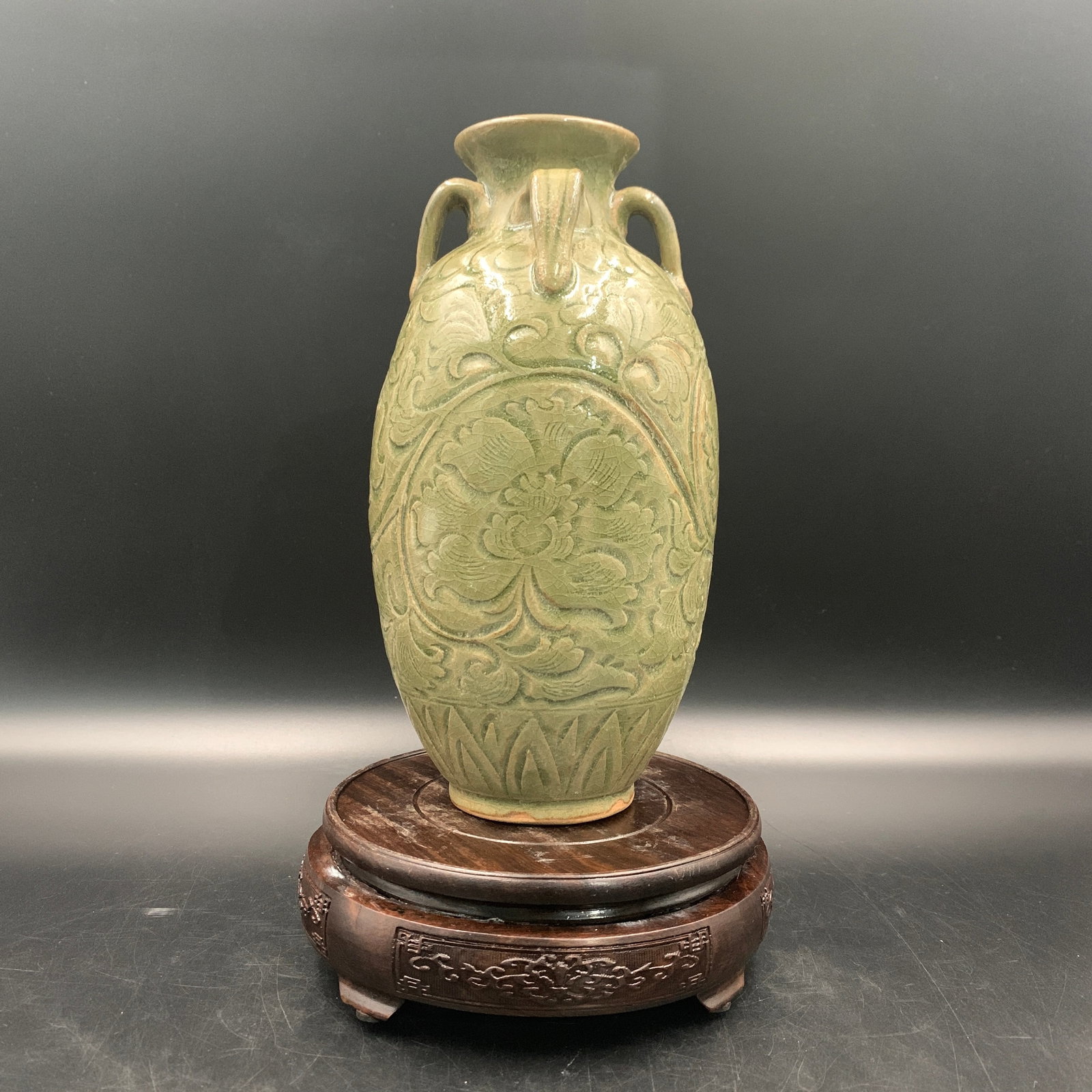 A FINE CELADON-GLAZED CARVED 'PEONY' PORCELAIN VASE