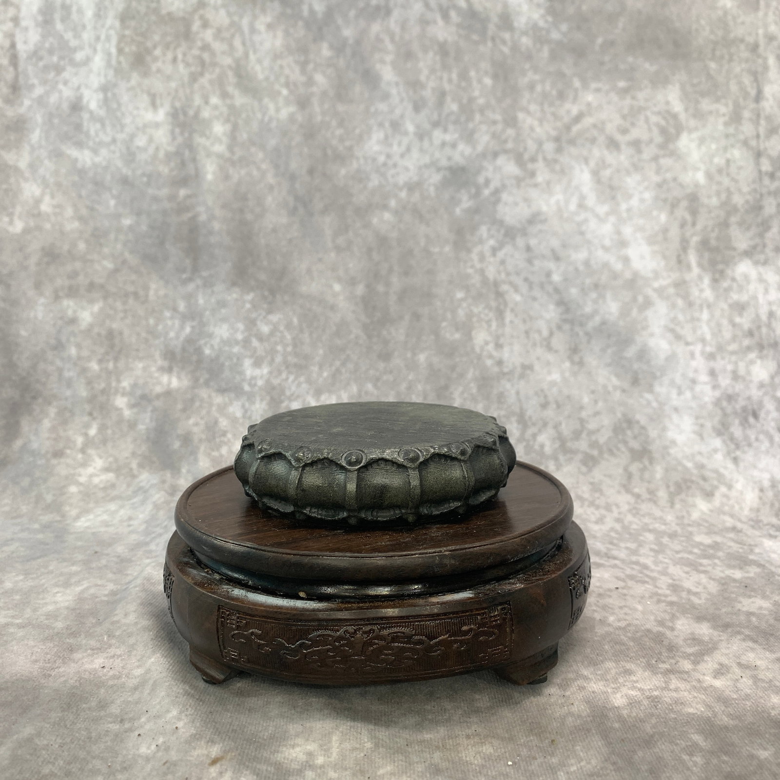 A FINE STONE DRUM-FORM SQUARE BASE