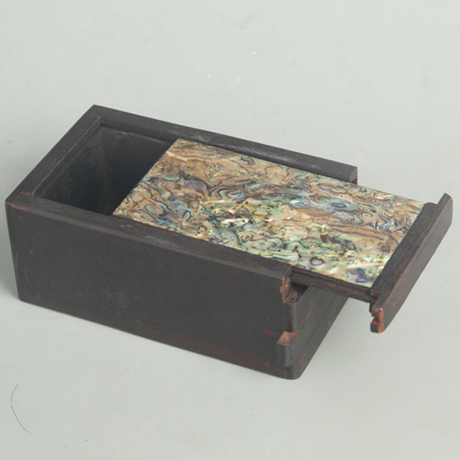 A HARDWOOD BOX INLAID WITH MOTHER-OF-PEARL