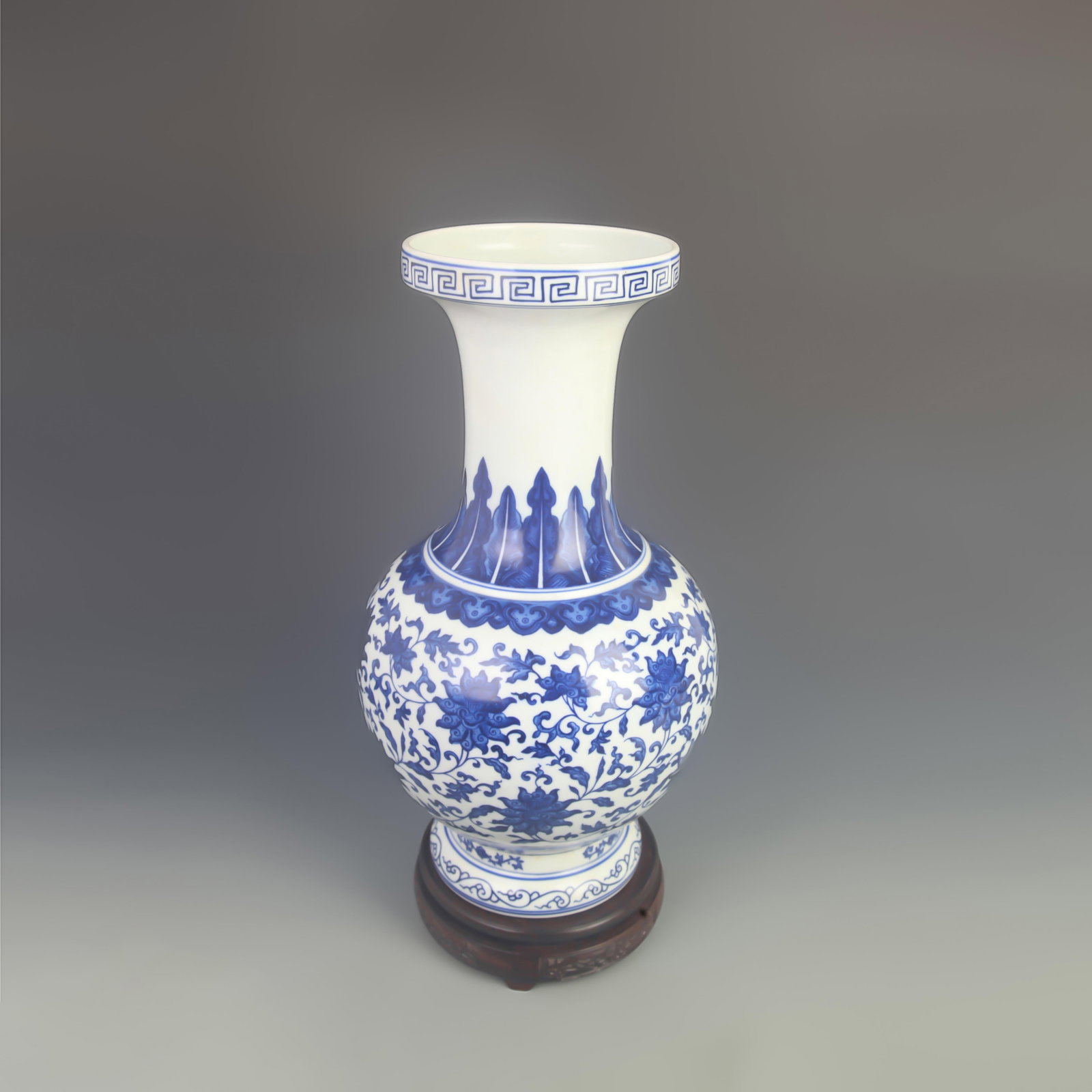 A FINE BLUE AND WHITE LOTUS SCROLL PORCELAIN VASE: Qing Dynasty Qian Long Period; High:16.0 inch; Diameter:8.00 inch; Wooden base for diplay only