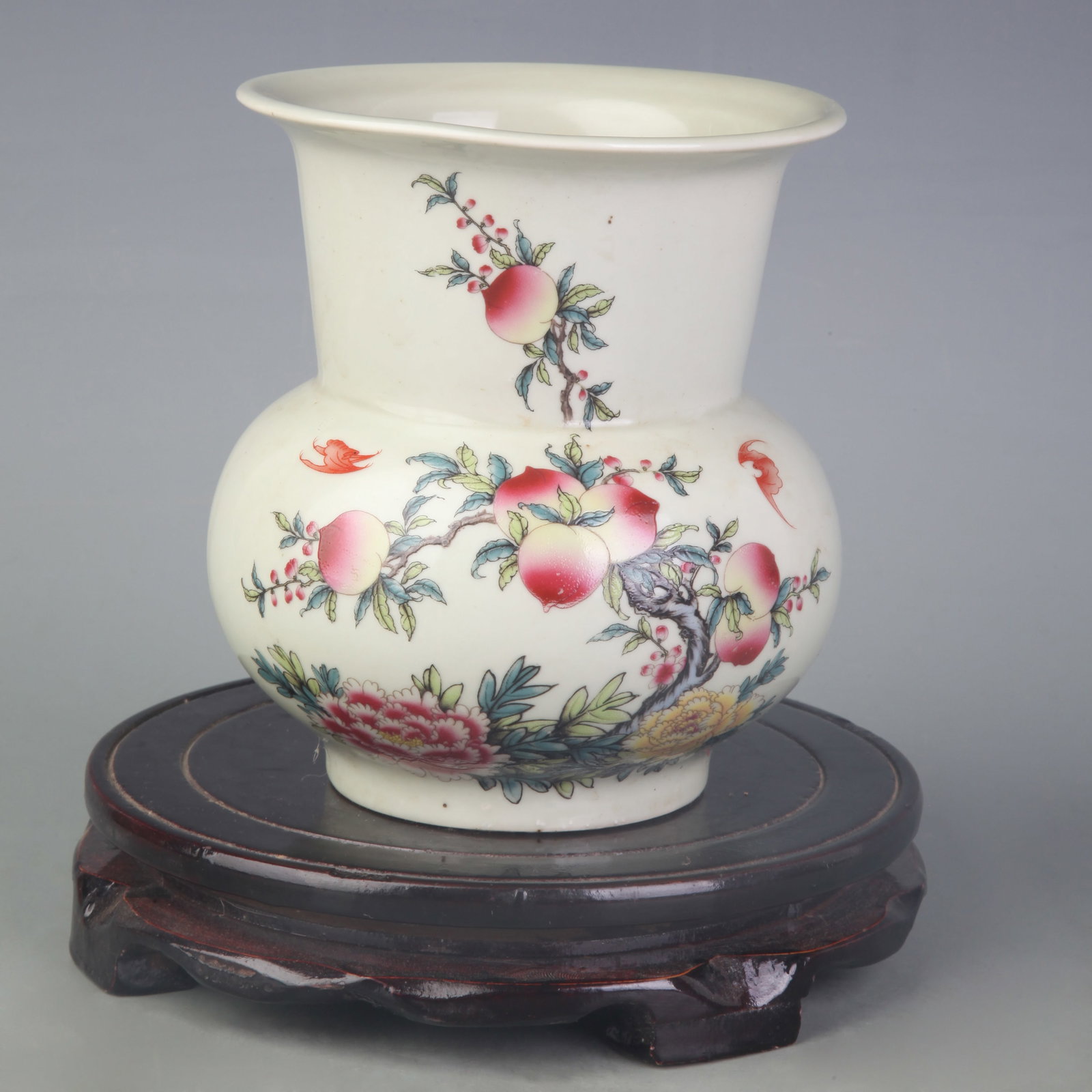PEA-GREEN-GLAZED SPITTOON WITH FLOWER DECORATION: Qing Dynasty Yong Zheng Period; High: 5.6 inch; Diameter: 4.6 inch; Wooden base for diplay only