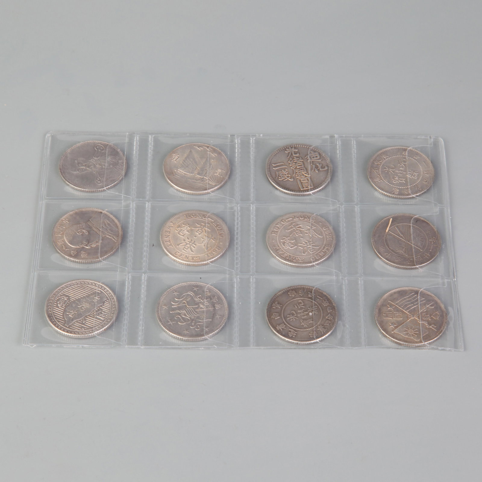 GROUP OF TWELVE SILVER DOLLARS
