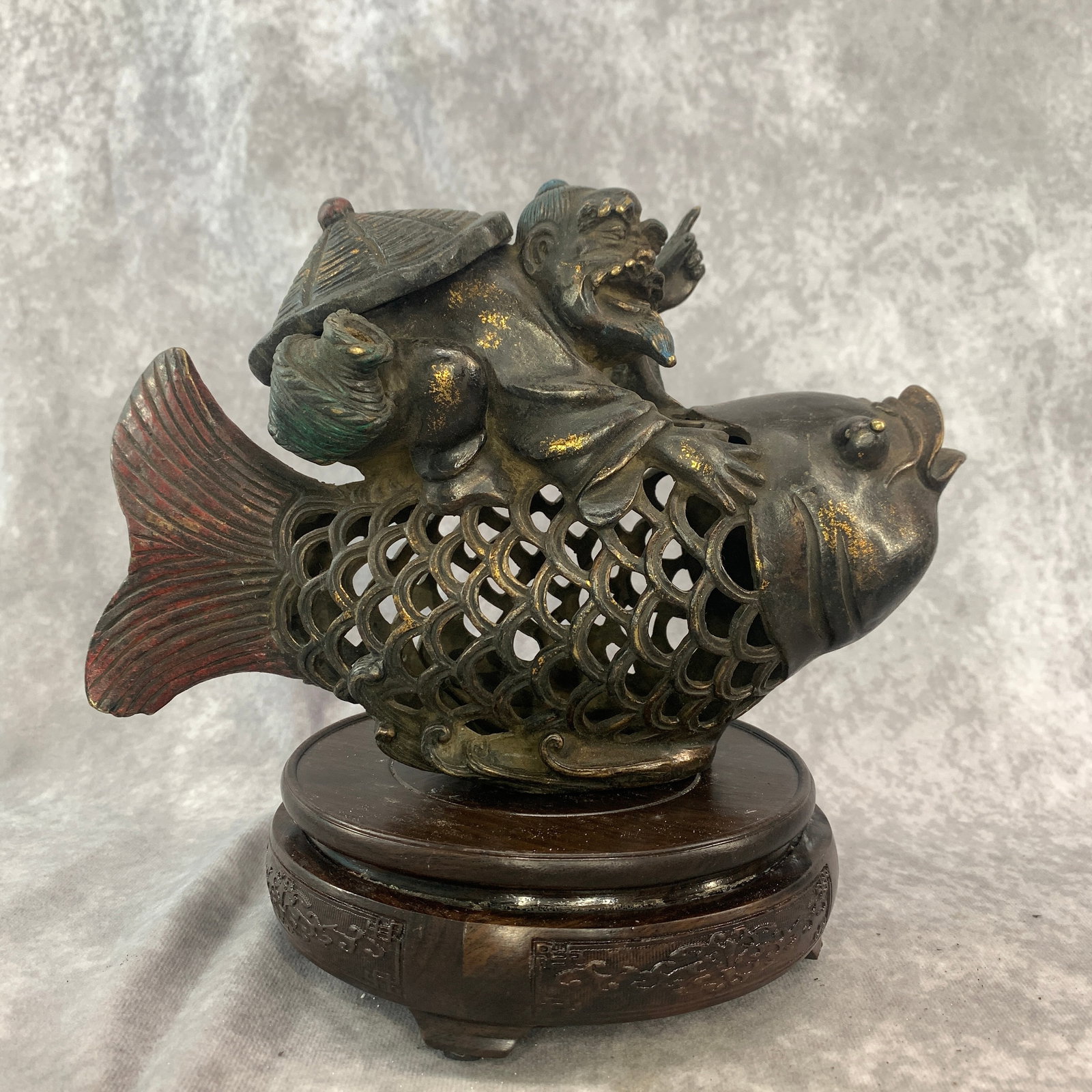 A FINE BRONZE INCENSE BURNER OF FISHERMAN RIDING FISH STYLE