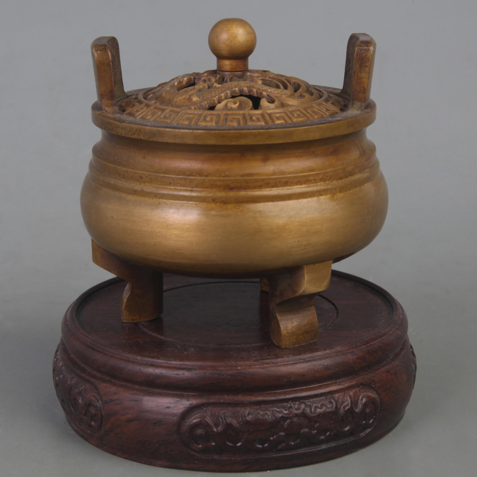 A FINE DRAGON CARVING THREE FOOT INCENSE BURNER: Ming Dynasty, Diameter: 2.9 inch High: 3.0 inch; Wooden base for diplay only