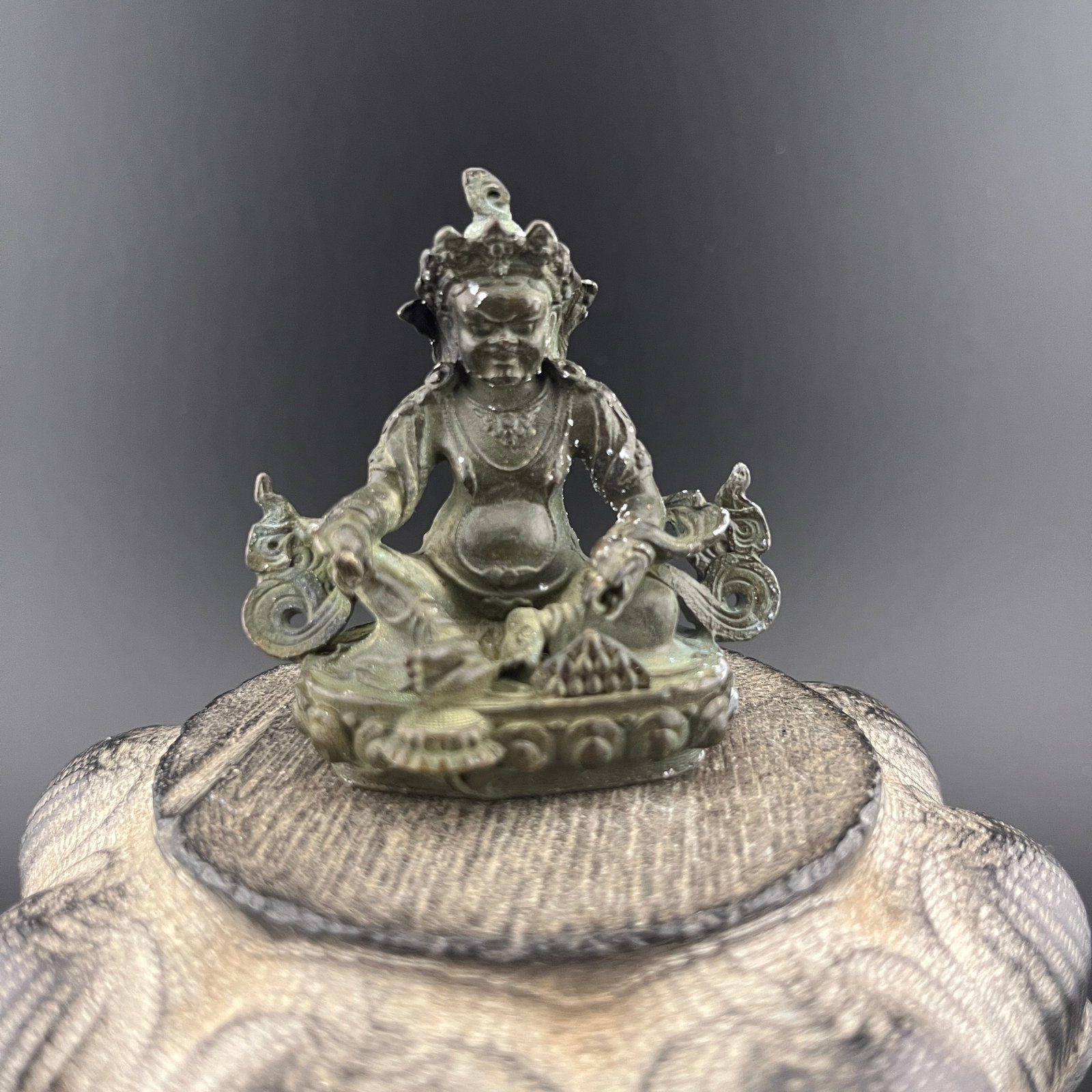 A FINE SMALL BRONZE JAMBHALA, GOD OF WEALTH
