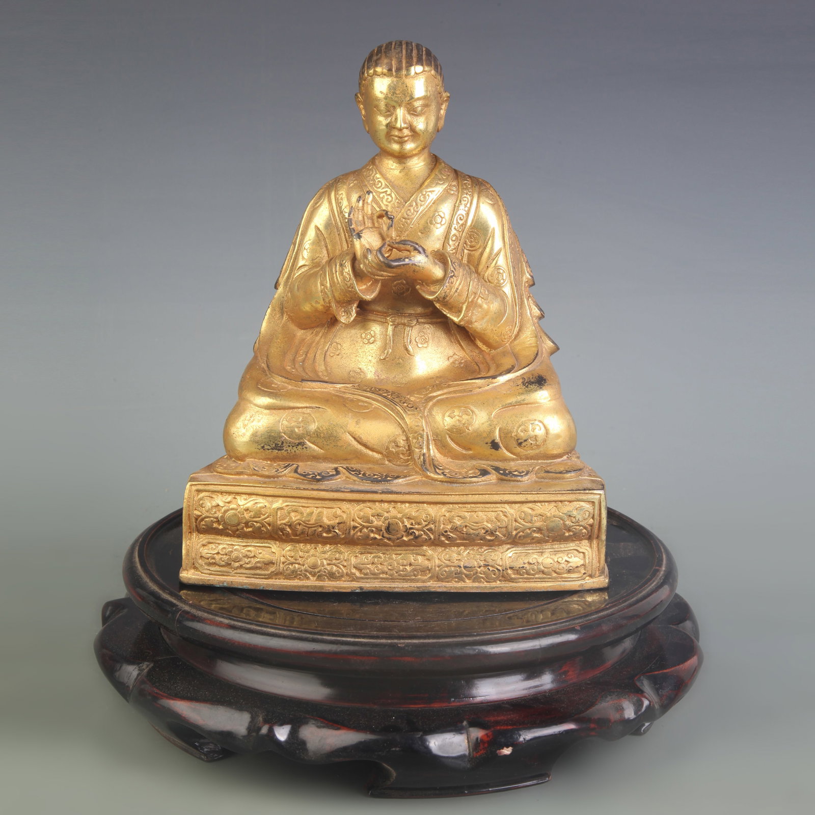 RARE TIBETAN BUDDHISM BRONZE GILT STATUE OF A SEATED LAMA: Qing Dynasty; Width: 6.6 inch; High: 8.2 inch; Wooden base for diplay only