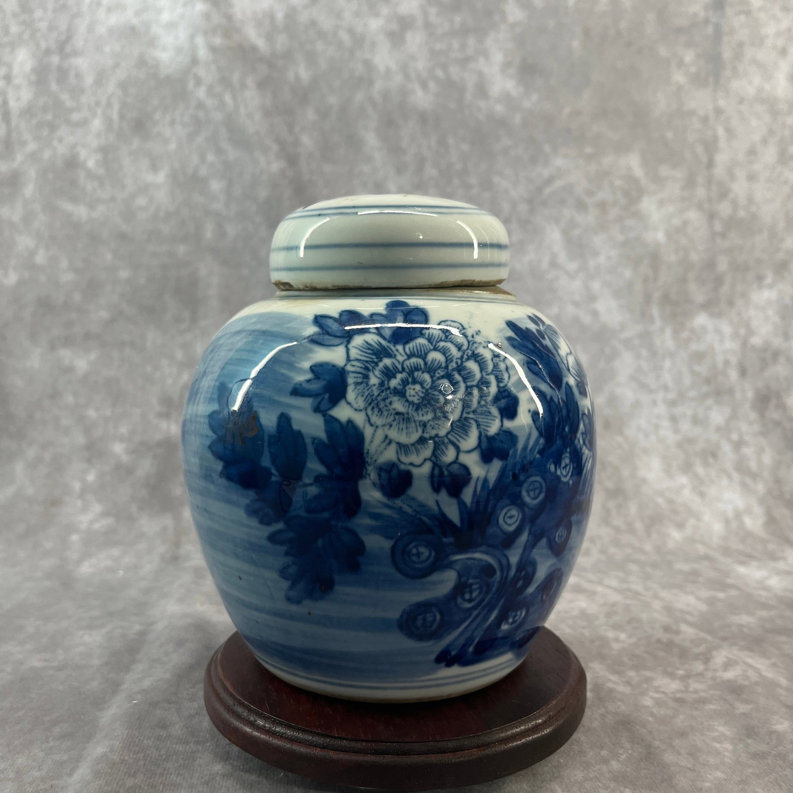 A FINE BLUE AND WHITE 'PEONY AND PEACOCK' COVERED GINGER JAR