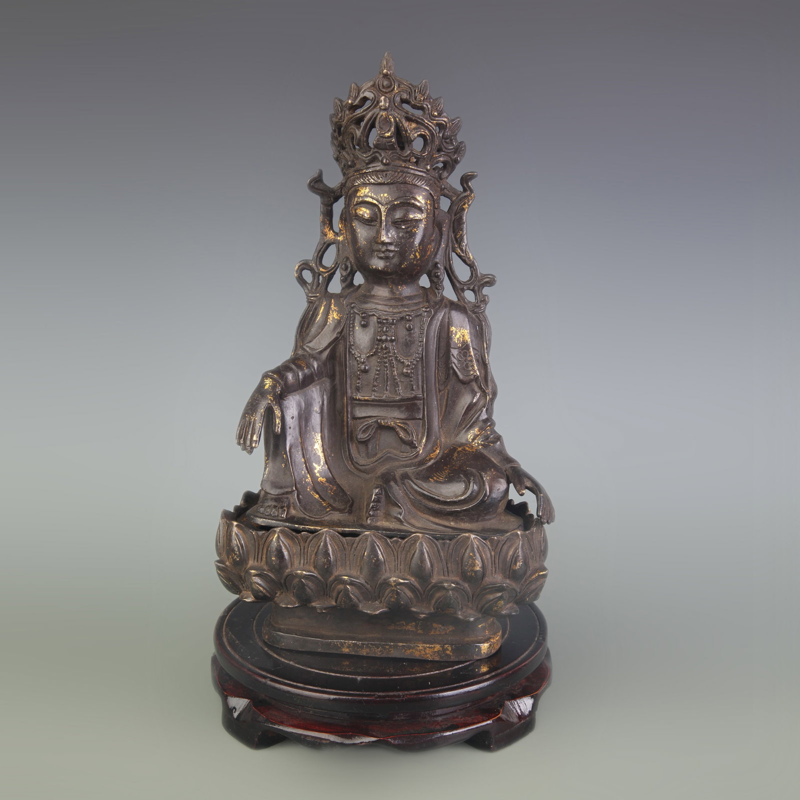 A FINE BRONZE SEATED FIGURE OF GUANYIN: Qing Dynasty; High: 11.1 inch; Wooden base for diplay only