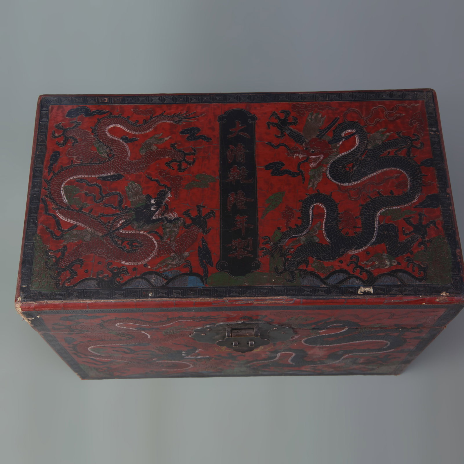 A FINE CARVED LACQUER BOX WITH DRAGON MOTIF