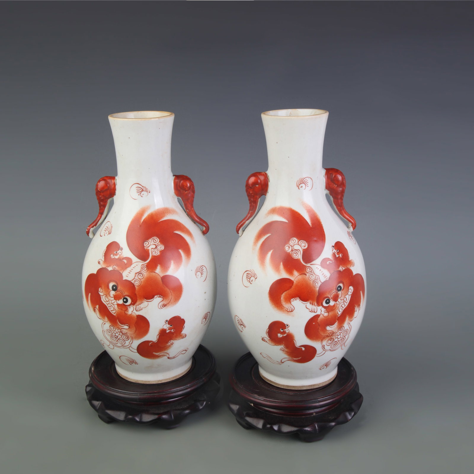 PAIR OF FAMILLE ROSE ELEPHANT-HEAD VASES WITH BEAST DECORATION