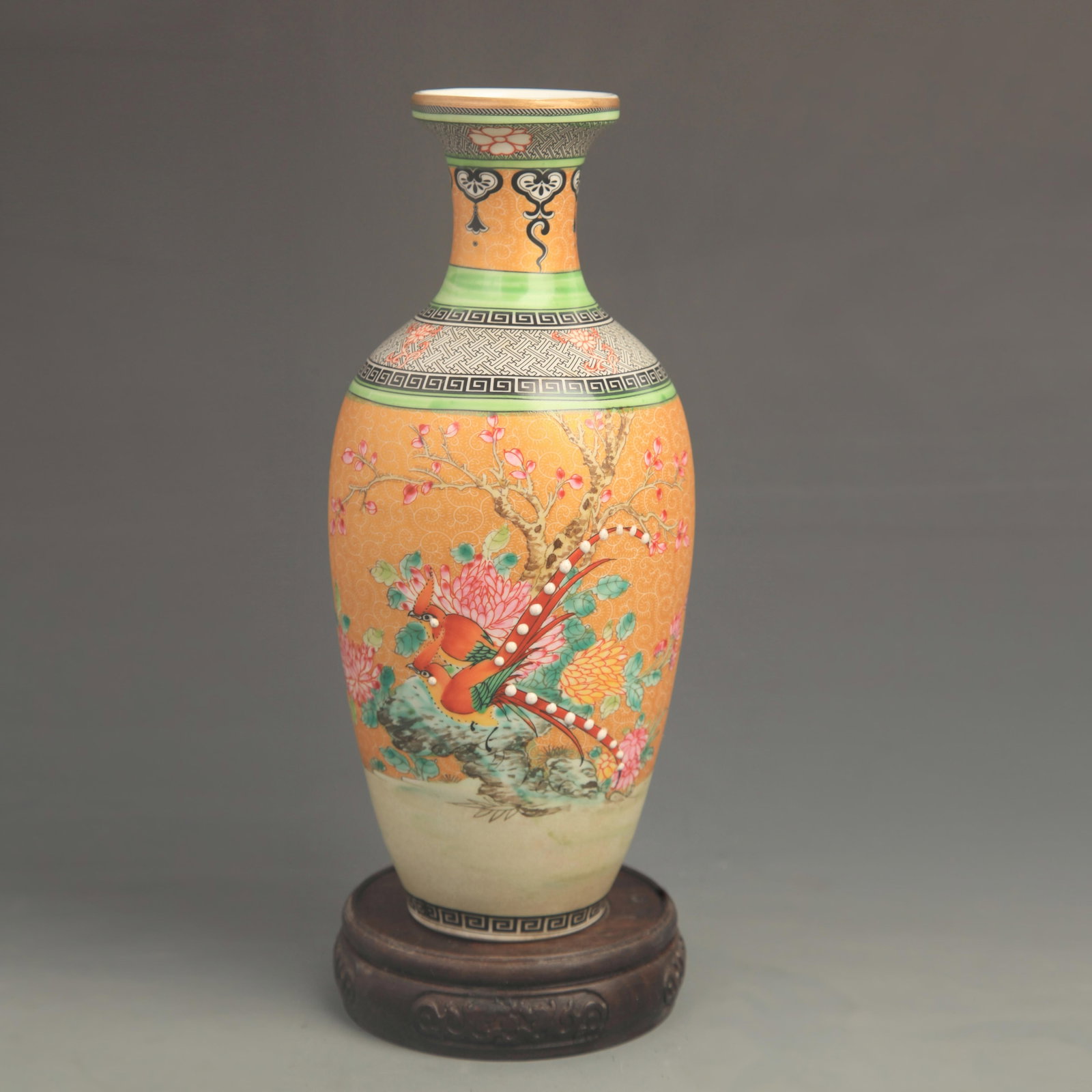 ENAMEL COLOR YELLOW GROUND FLOWER AND BIRD PORCELAIN VASE: Qing Dynasty Yong Zheng Period; High: 9.00 inch; Diameter: 3.80 inch; Wooden base for diplay only