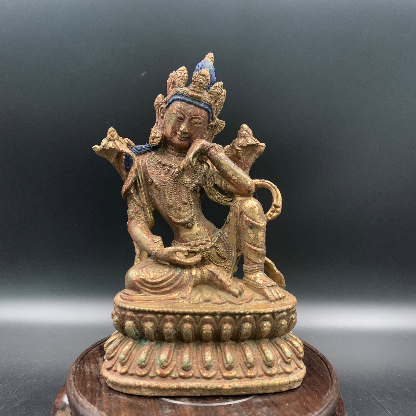 RARE TIBETAN GILT BRONZE FIGURE OF AVALOKITESHVARA SEATED IN ROYAL EASE: Ming Dynasty Style; Long: 4.4 inch; Width: 2.9 inch; High: 7.3 inch; Wooden base for diplay only