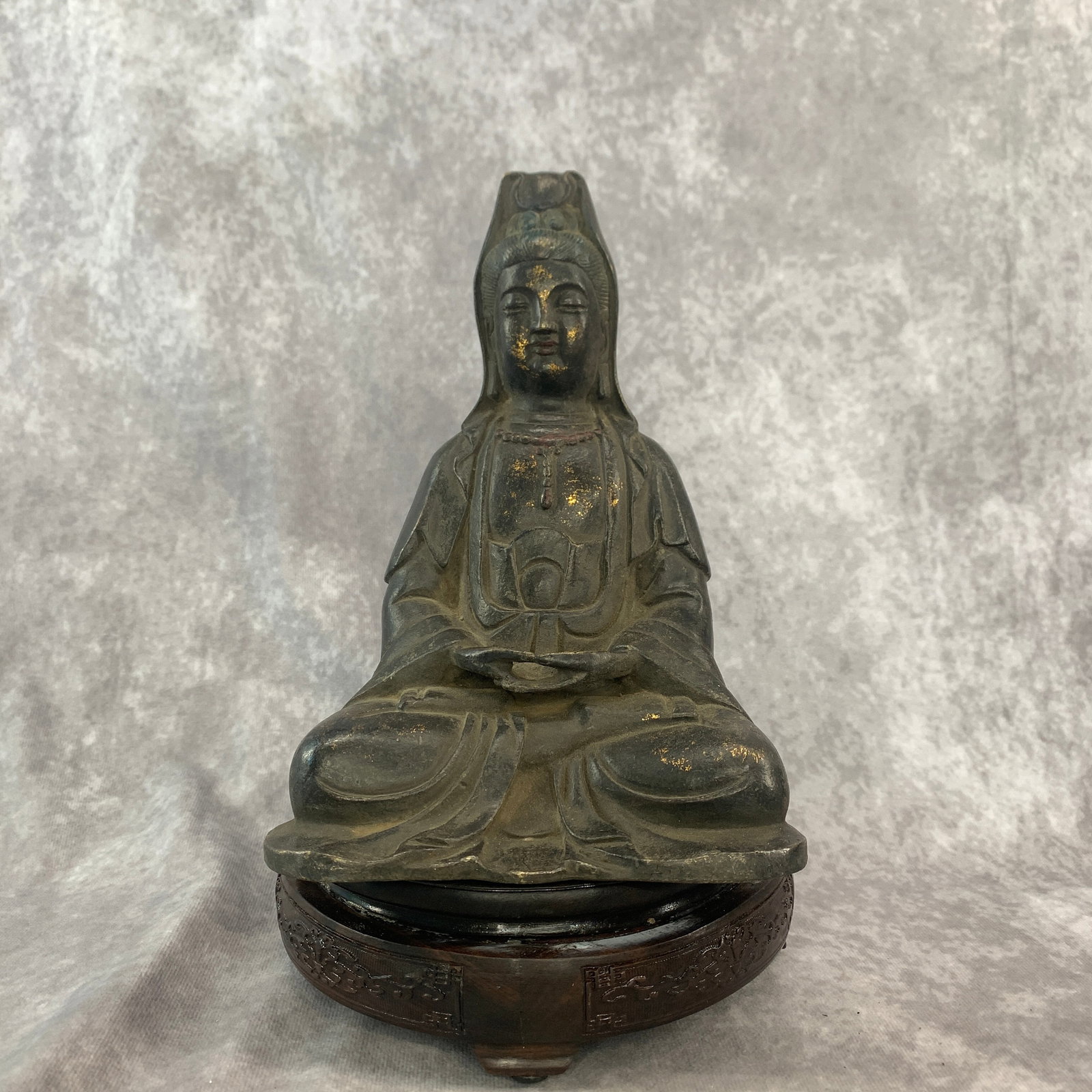 ?A GILT BRONZE FIGURE OF SEATED AVALOKITESVARA (GUANYIN): Qing Dynasty; Long: 6 inch; Width: 4.3 inch; High: 8.4 inch; Wooden base for diplay only