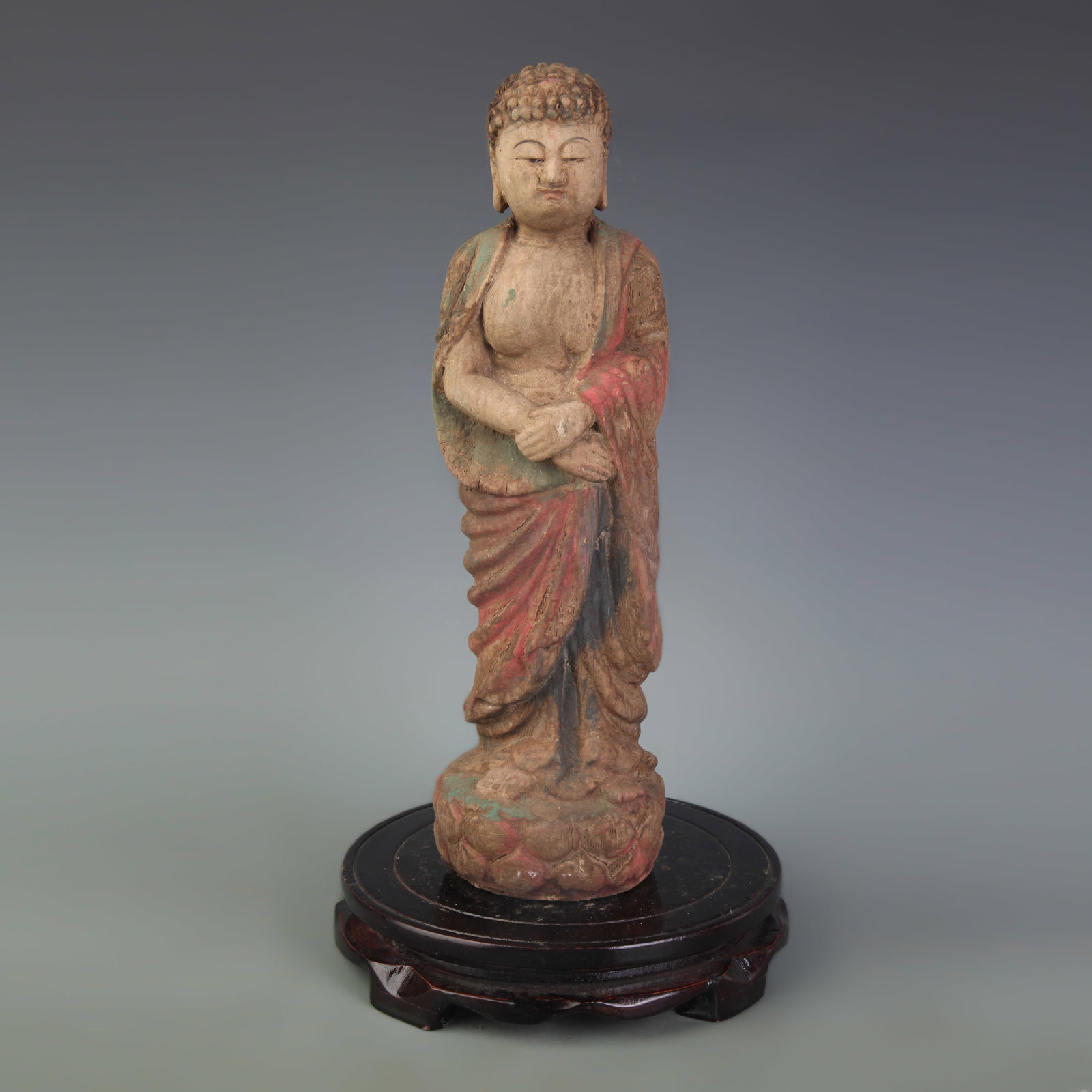 A POLYCHROME PAINTED WOOD CARVED STANDING FIGURE OF BUDDHA: Republic Period; High: 16.0 inch; Wooden base for diplay only
