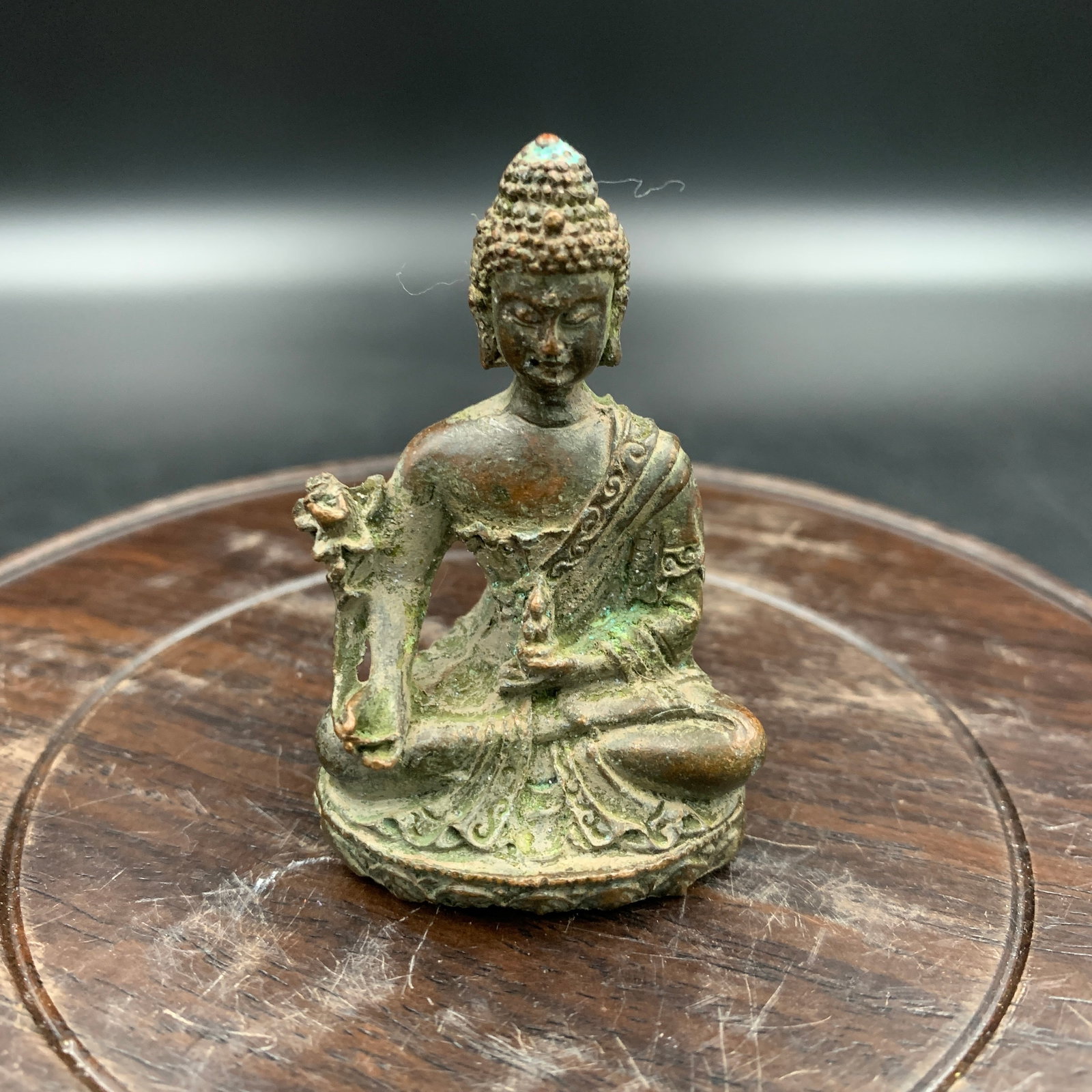 SMALL BRONZE MEDICINE BUDDHA (BHAISAJYAGURU) STATUE: Modern; Long: 1.5 inch; Width: 1.1 inch; High: 2.4 inch; Wooden base for diplay only