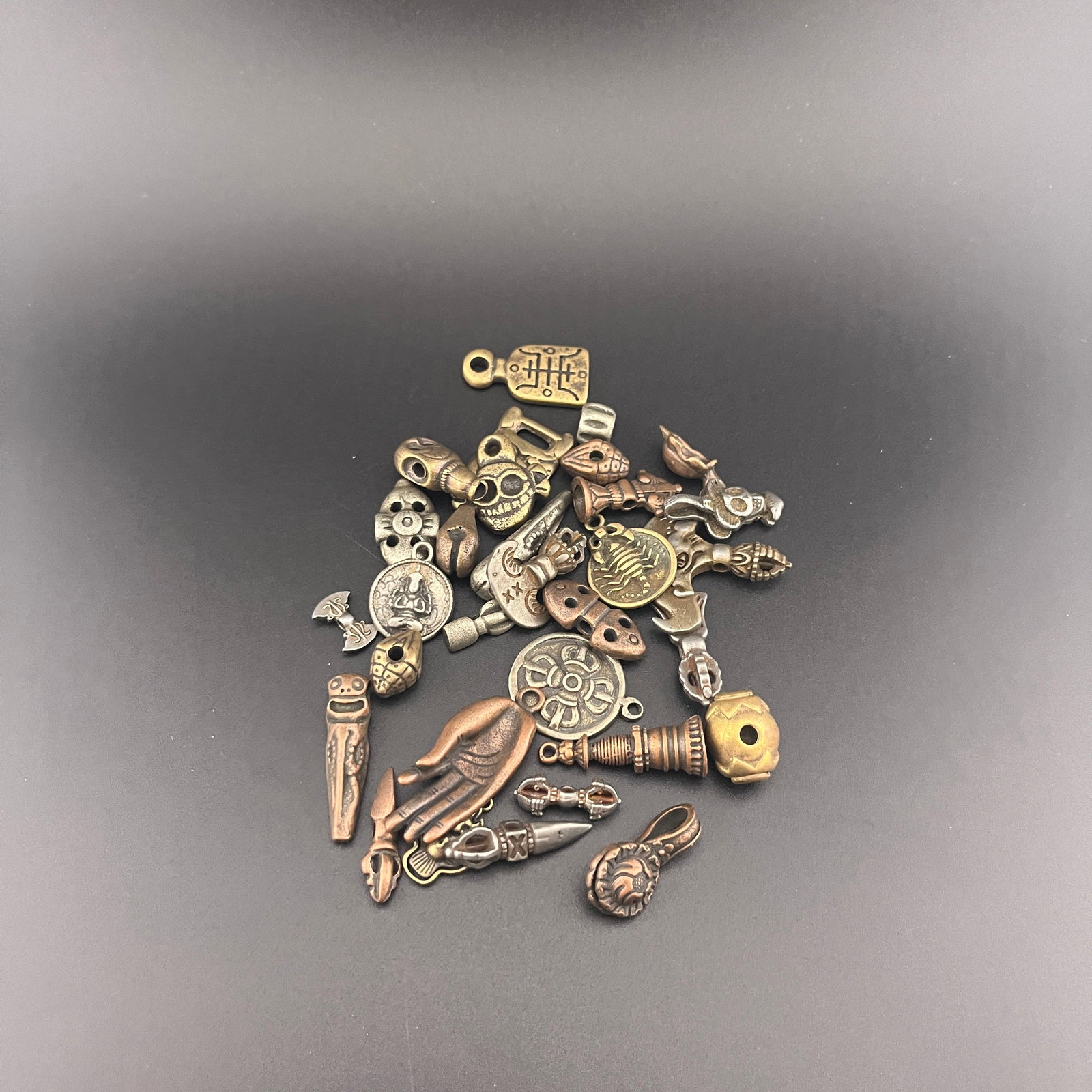 GROUP OF SMALL TIBETAN BUDDHIST RITUAL INSTRUMENTS